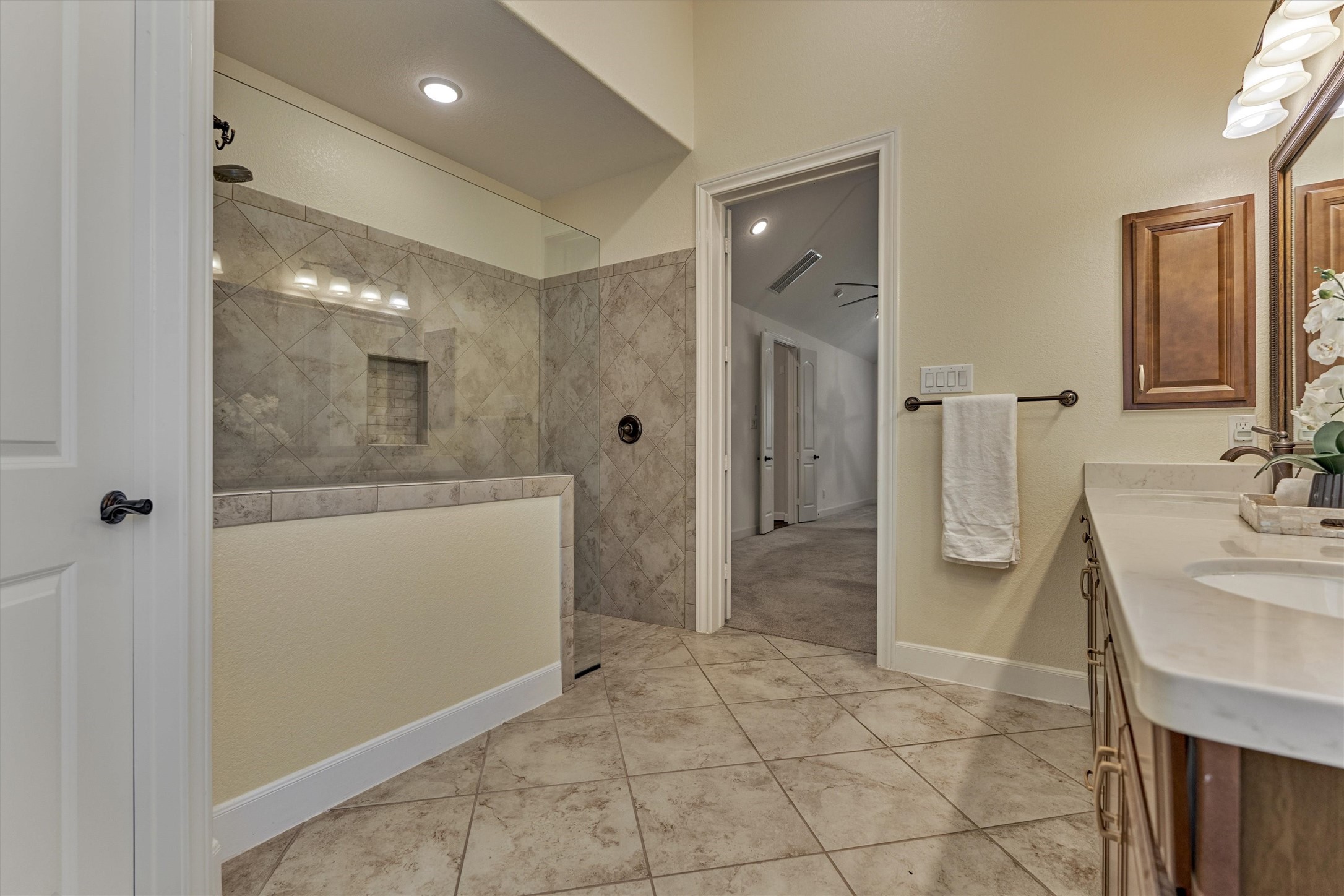 Wonderful oversized shower with bench.
