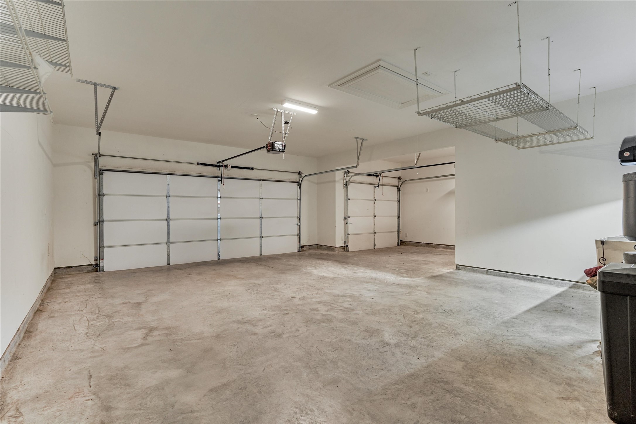 Rare 3-car garage with workstation and sink!