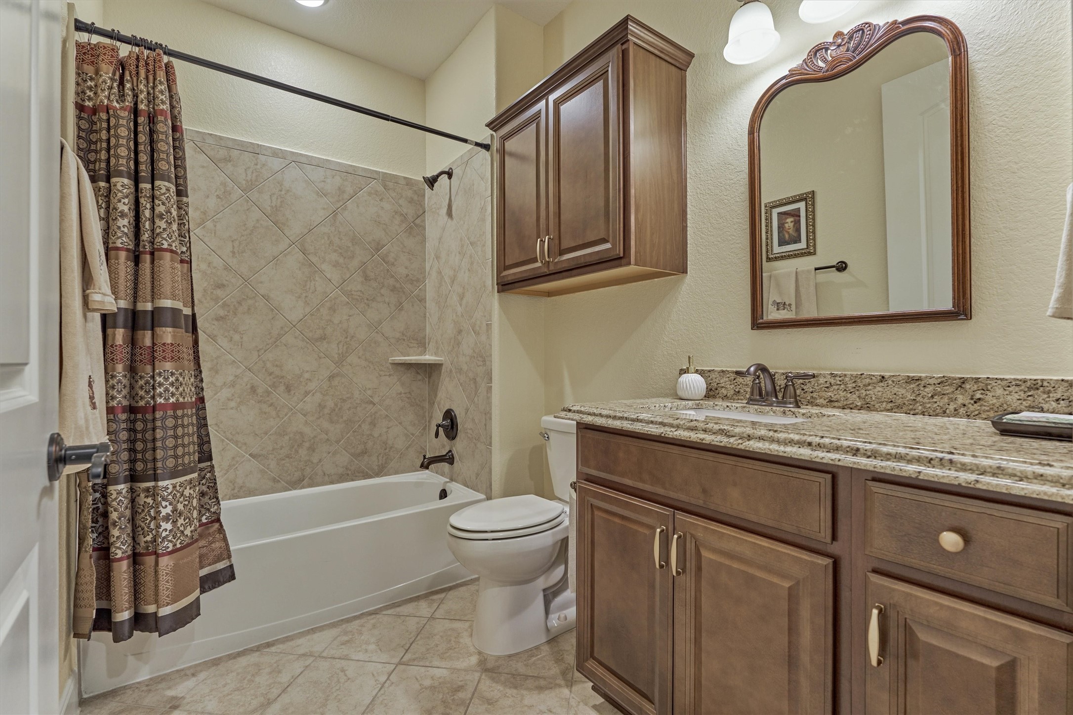 Full bathroom with tub/shower combo for secondary bedroom #1.