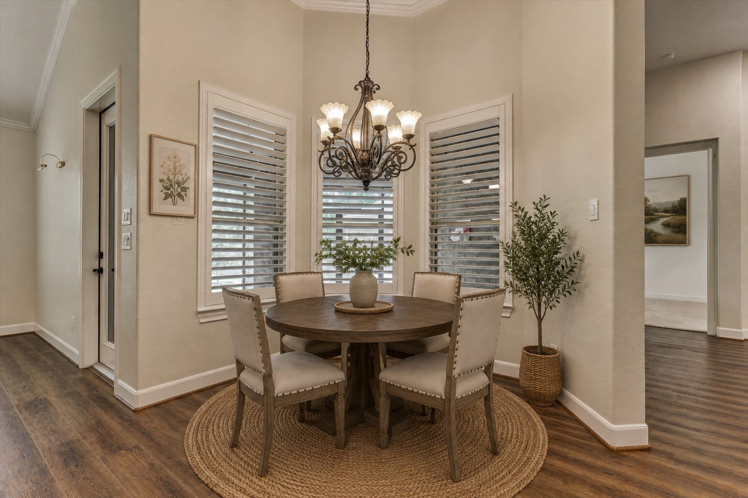 *This photo is virtually staged* Charming breakfast room adjoins the kitchen and the den, with windows overlooking the screened in porch.