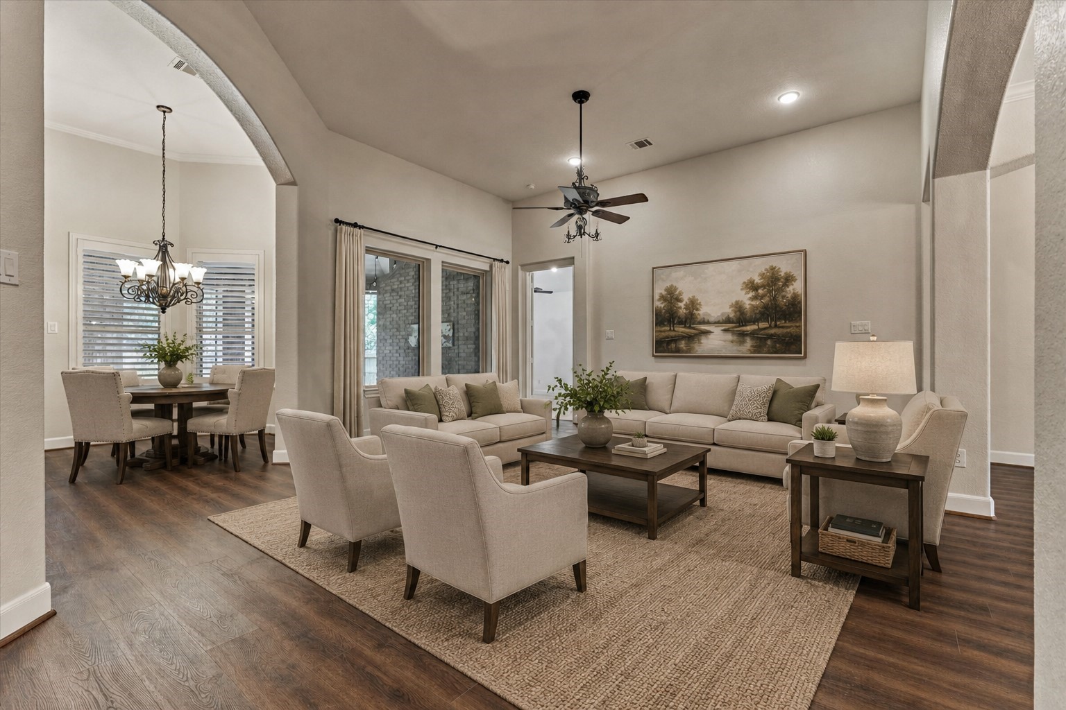 *This photo is virtually staged* Formal living room features space and windows overlooking the screened in patio.