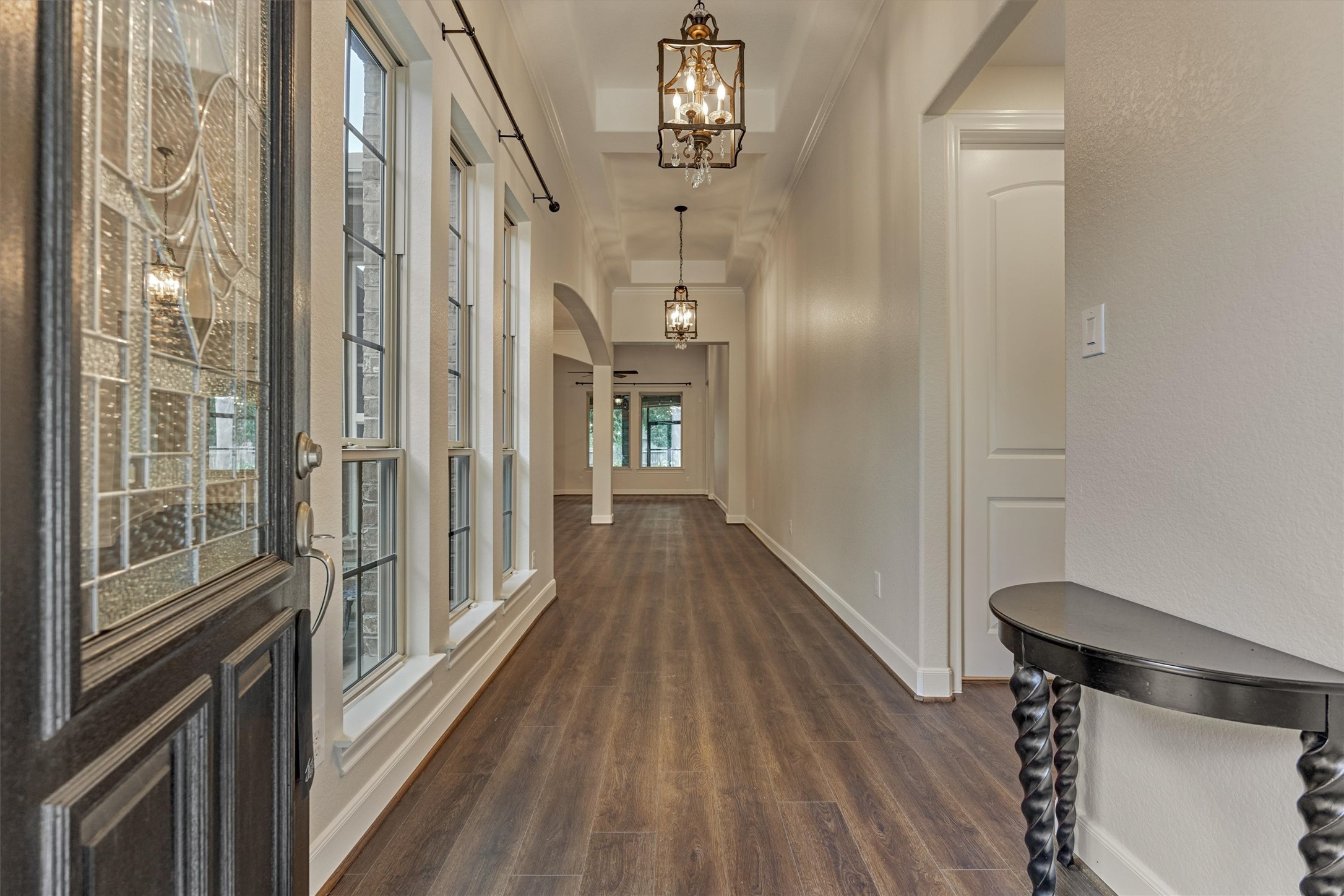 Step inside to an immaculately maintained interior with continuous vinyl plank flooring and high ceilings throughout. Step inside to an immaculately maintained interior with continuous vinyl plank flooring and high ceilings throughout.