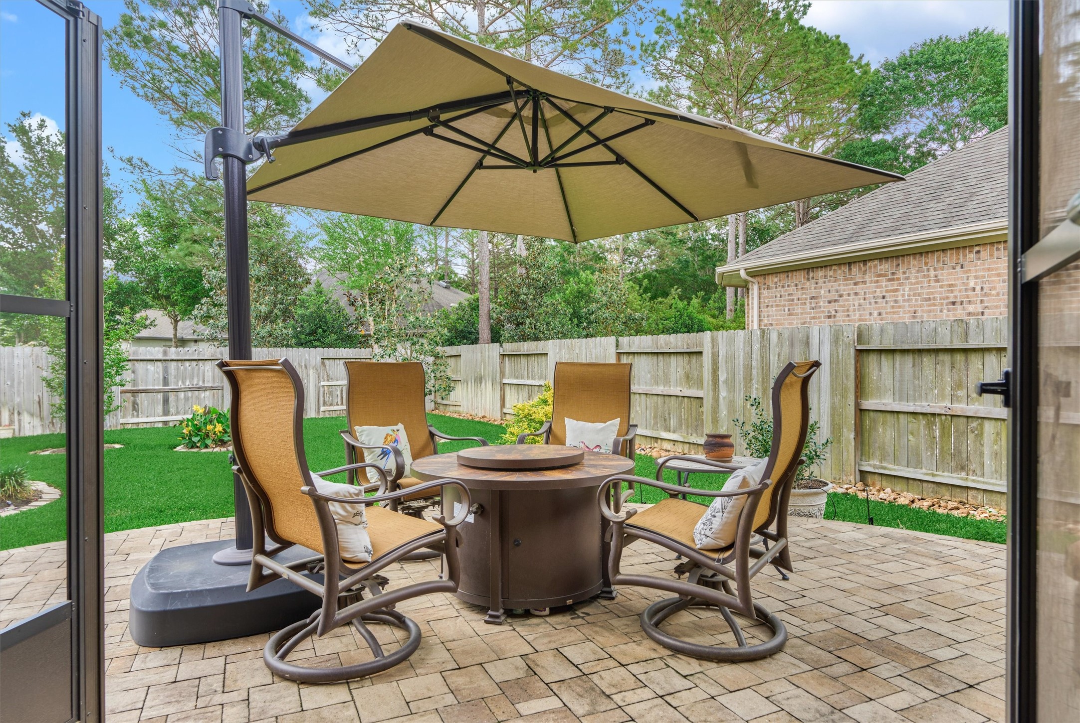 Step outside to the custom pavestone patio. Note: the umbrella is negotiable!