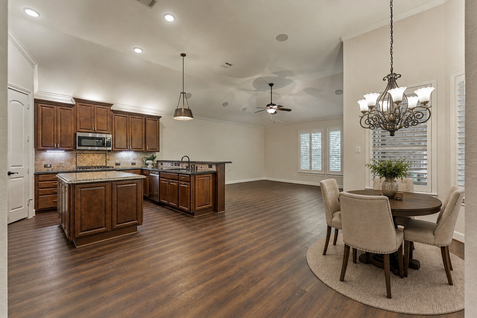 *This photo is virtually staged* The kitchen, breakfast room, and den exude space and design with a spacious floorplan!