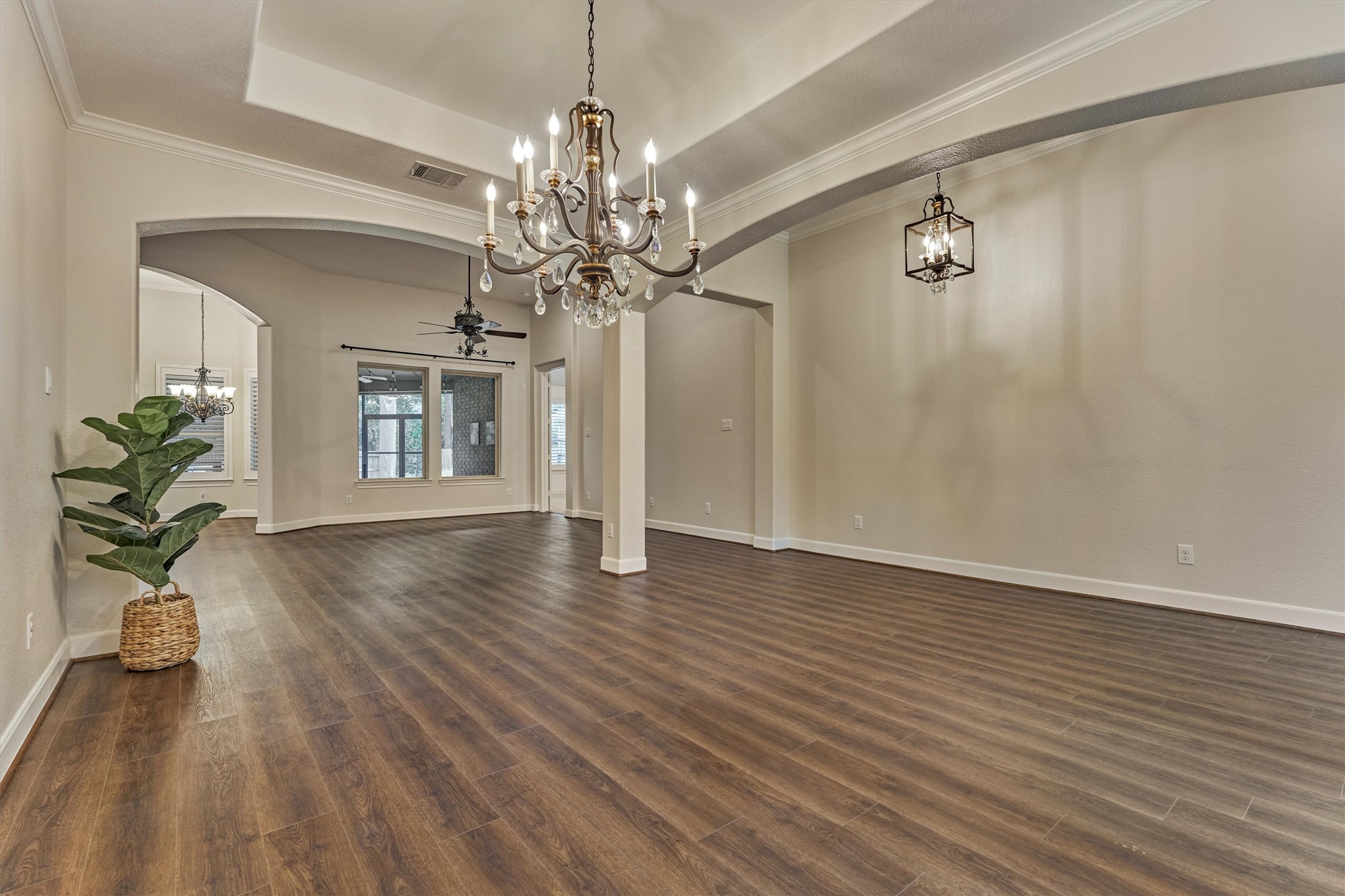 A stunning chandelier anchors the formal dining room. A stunning chandelier anchors the formal dining room.