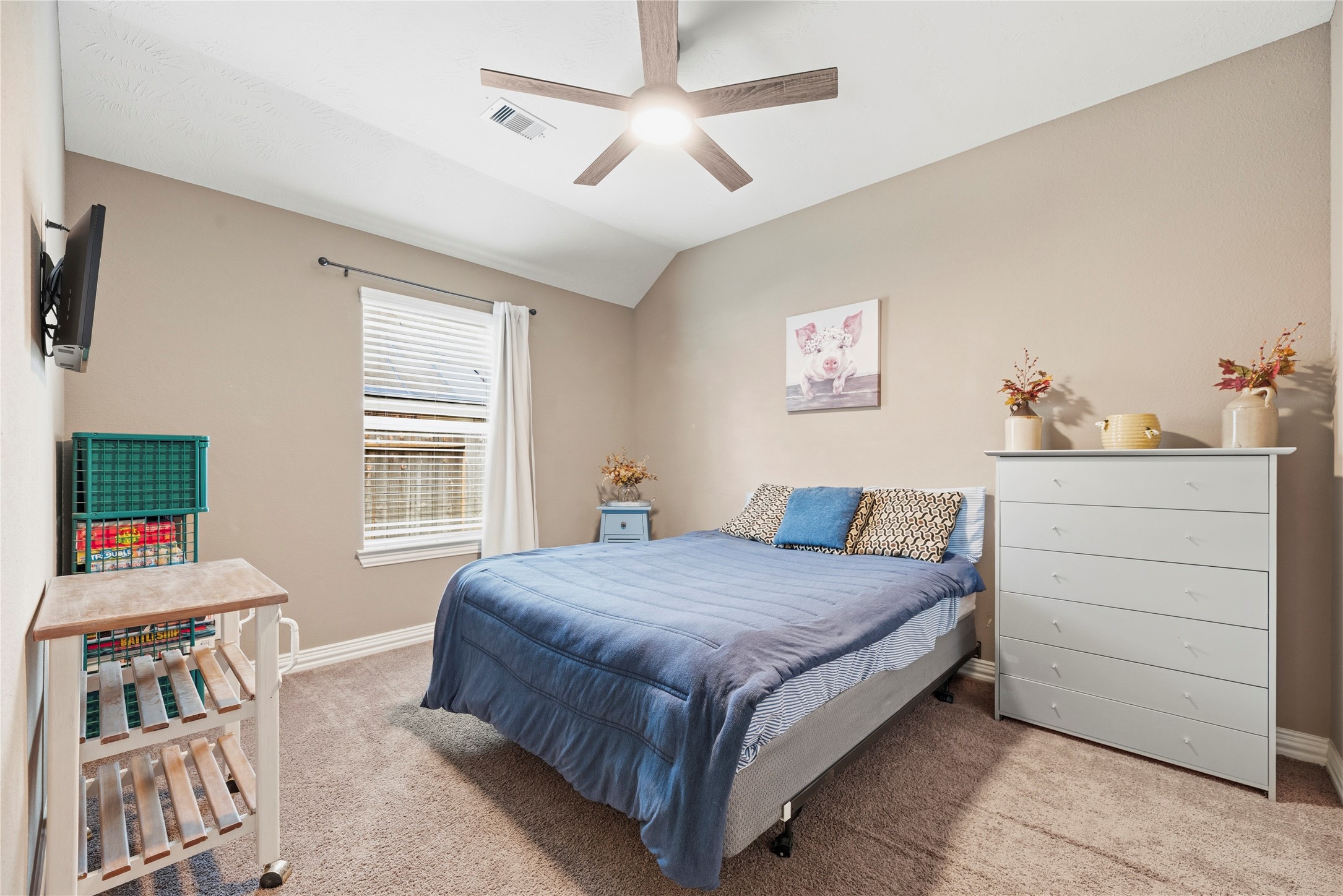 Both secondary bedrooms are spacious with plush carpet, ceiling fans and ample closet space.
