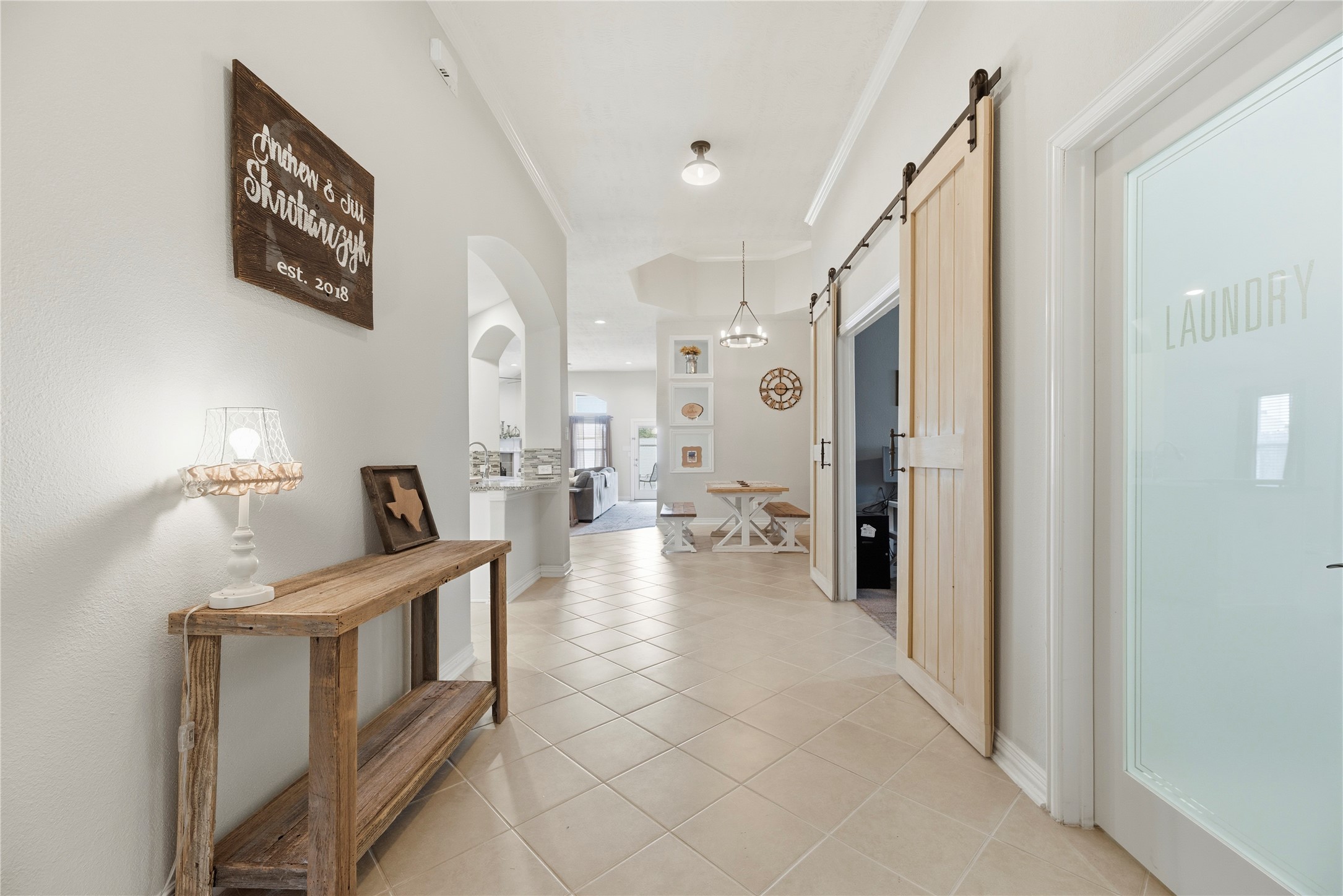 Tile flooring, high ceiling, crown molding and neutral paint upon entry. Tile flooring, high ceiling, crown molding and neutral paint upon entry.