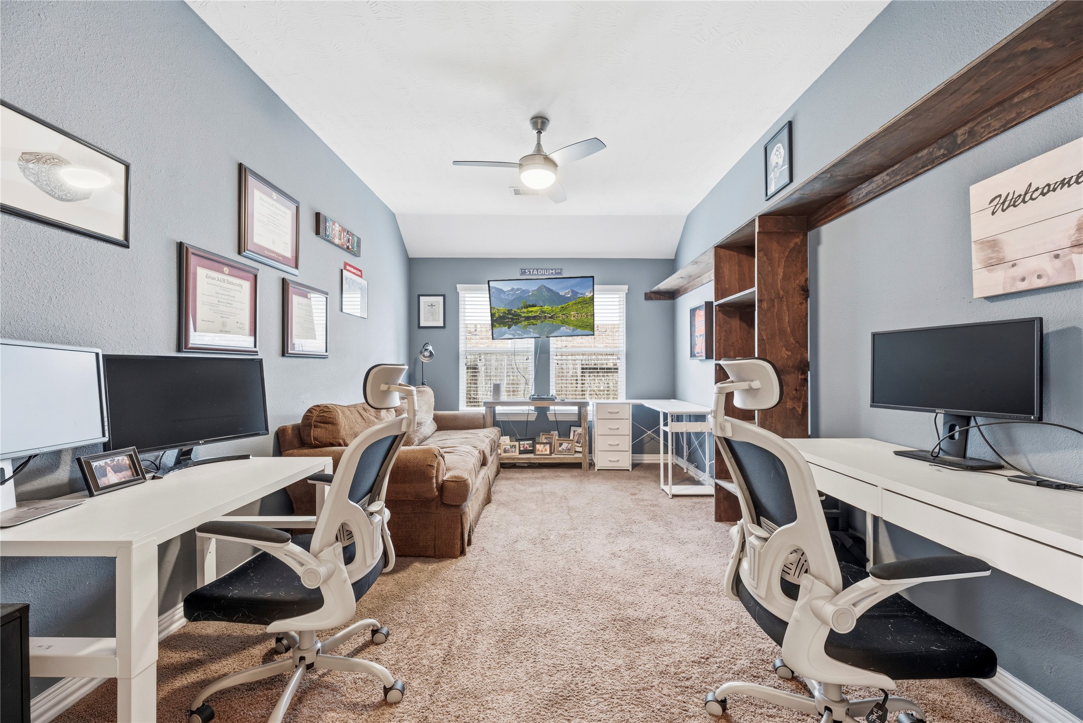 Barn doors lead to a private home office. Barn doors lead to a private home office.