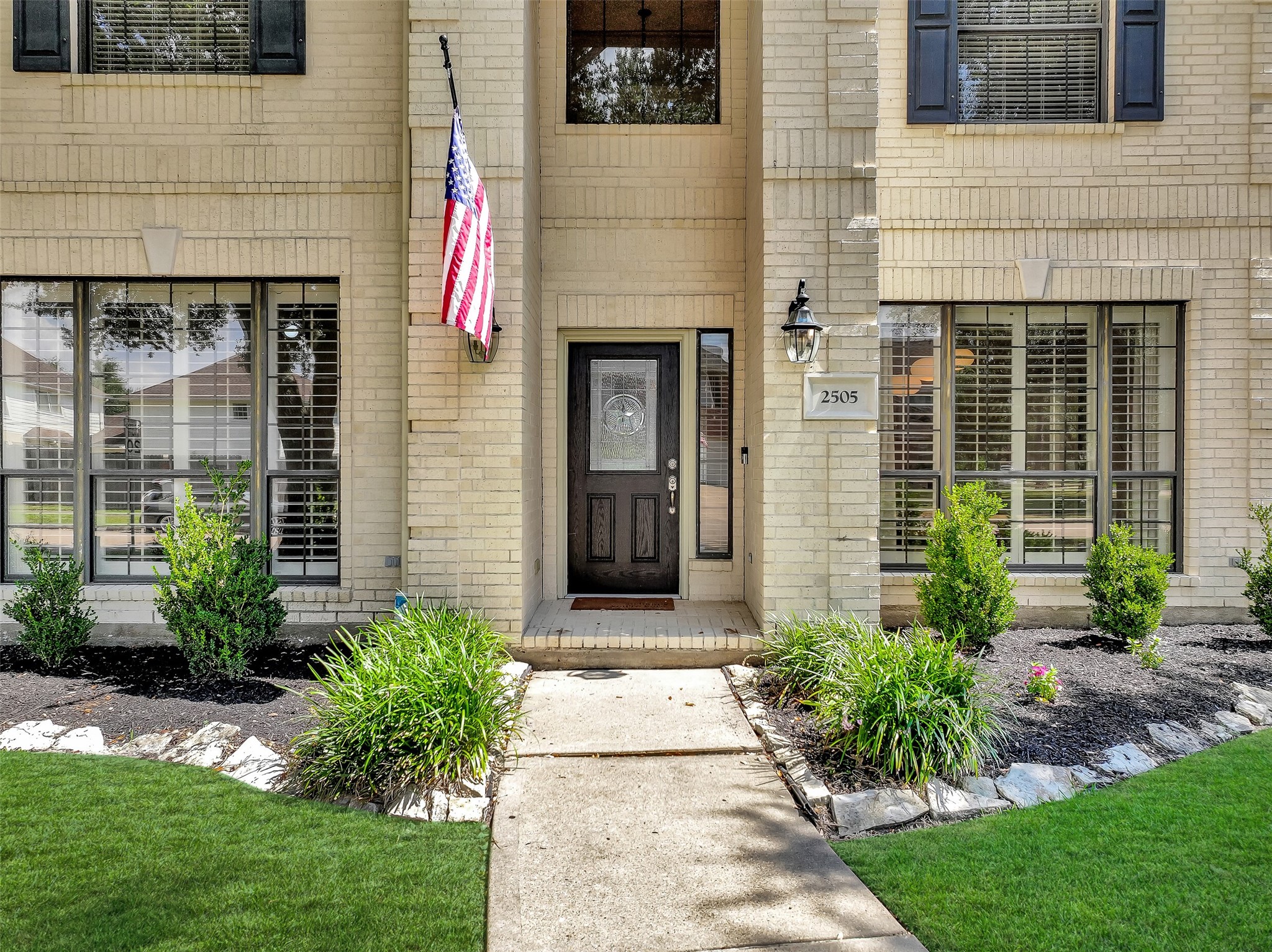 Follow the walkway to the welcoming covered entry, framed by fresh landscaping & classic painted brick. The glass-accented front door with coordinating sidelight opens to a soaring 2-story foyer, offering a bright and inviting introduction to the home.