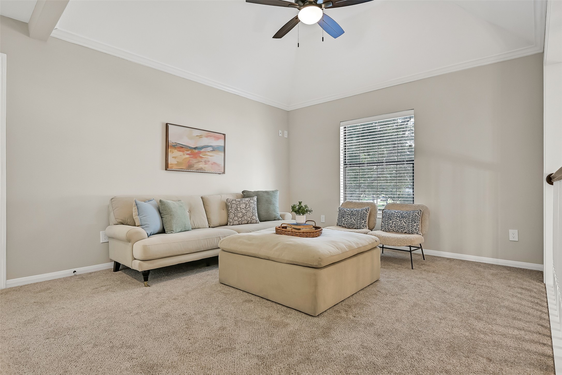 At the top of the stairs, a generous gameroom provides valuable additional living space for movies, games or relaxing. A tray ceiling with crown molding, ceiling fan and open overlook to the 2-story foyer add architectural interest.