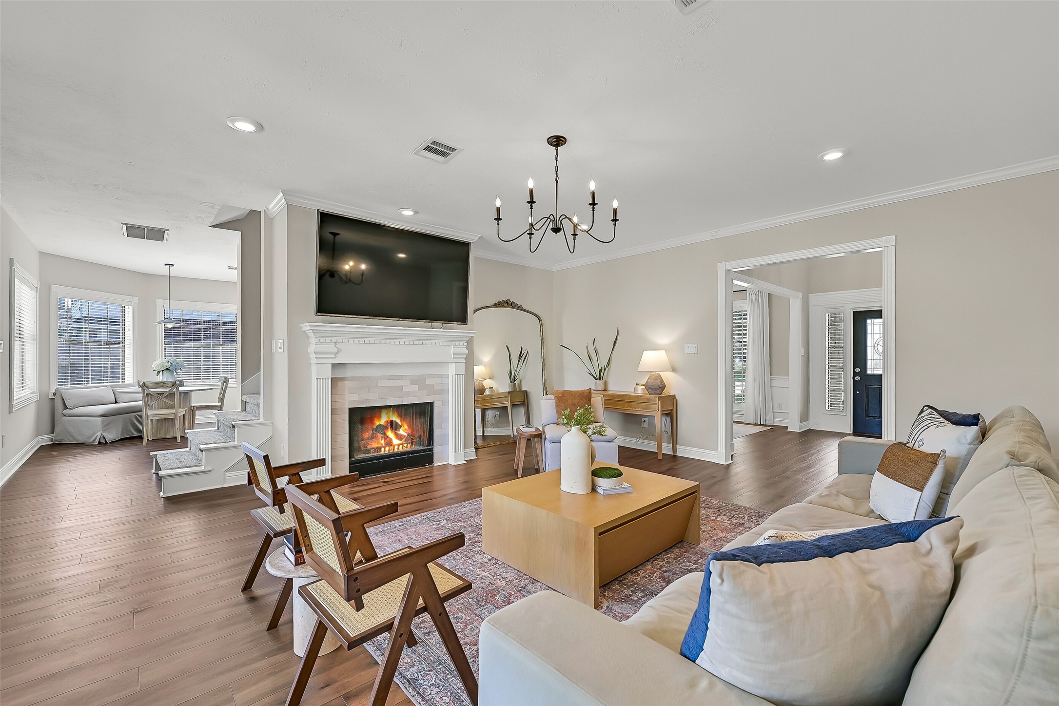 Continue through the 2-story foyer, flanked by the formal dining room & private study, into this spacious family room with warm LVP flooring, crown molding, recessed lighting & a gas-log fireplace. The breakfast area & kitchen are tucked just beyond for an easy-flowing floor plan.