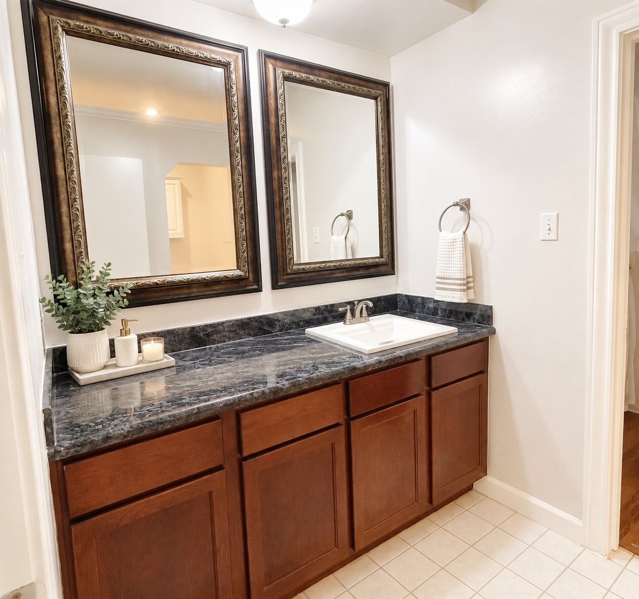 Virtually staged to showcase the vanitys potential with a welcoming touch and everyday functionality.
