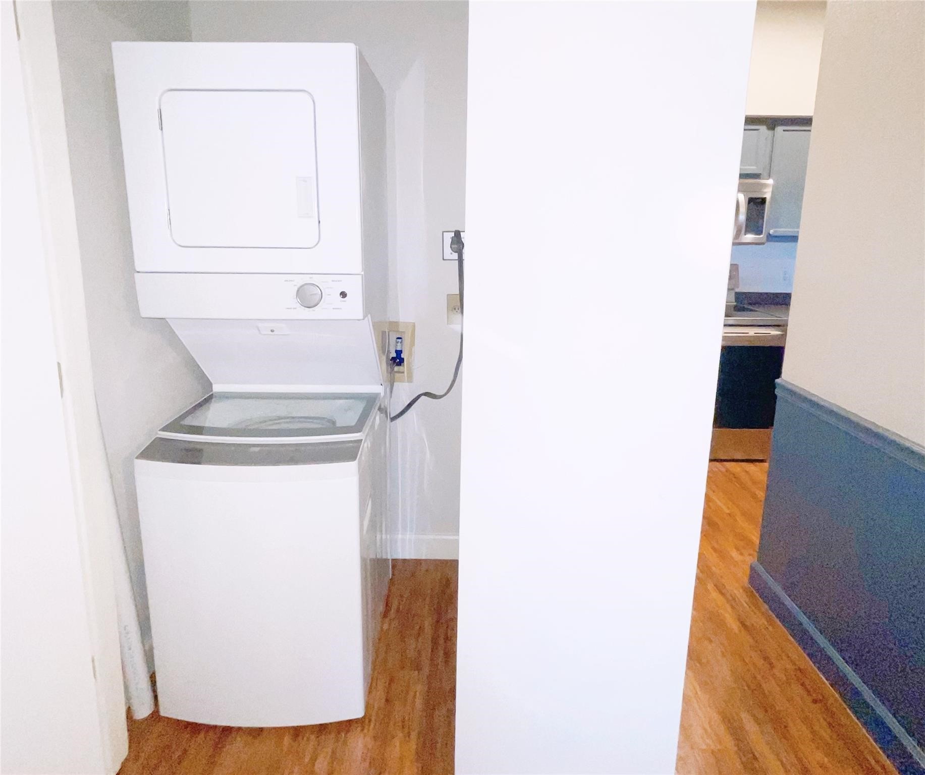 Laundry area features a convenient stackable washer and dryer for efficient use of space.