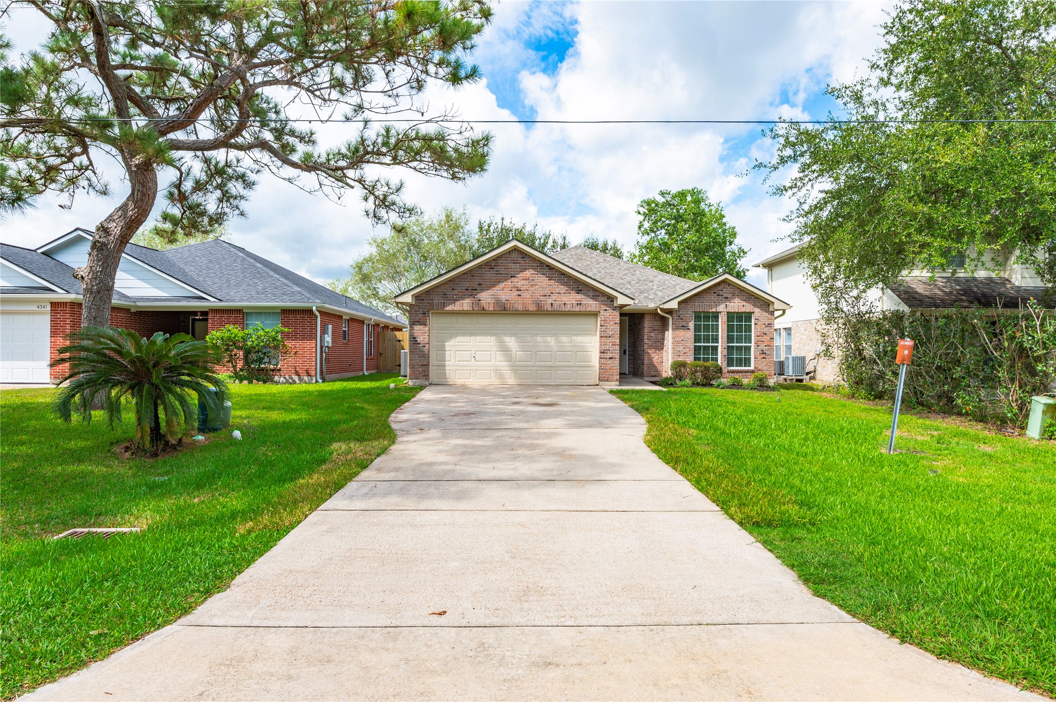 Extended driveway. Full brick exterior.
