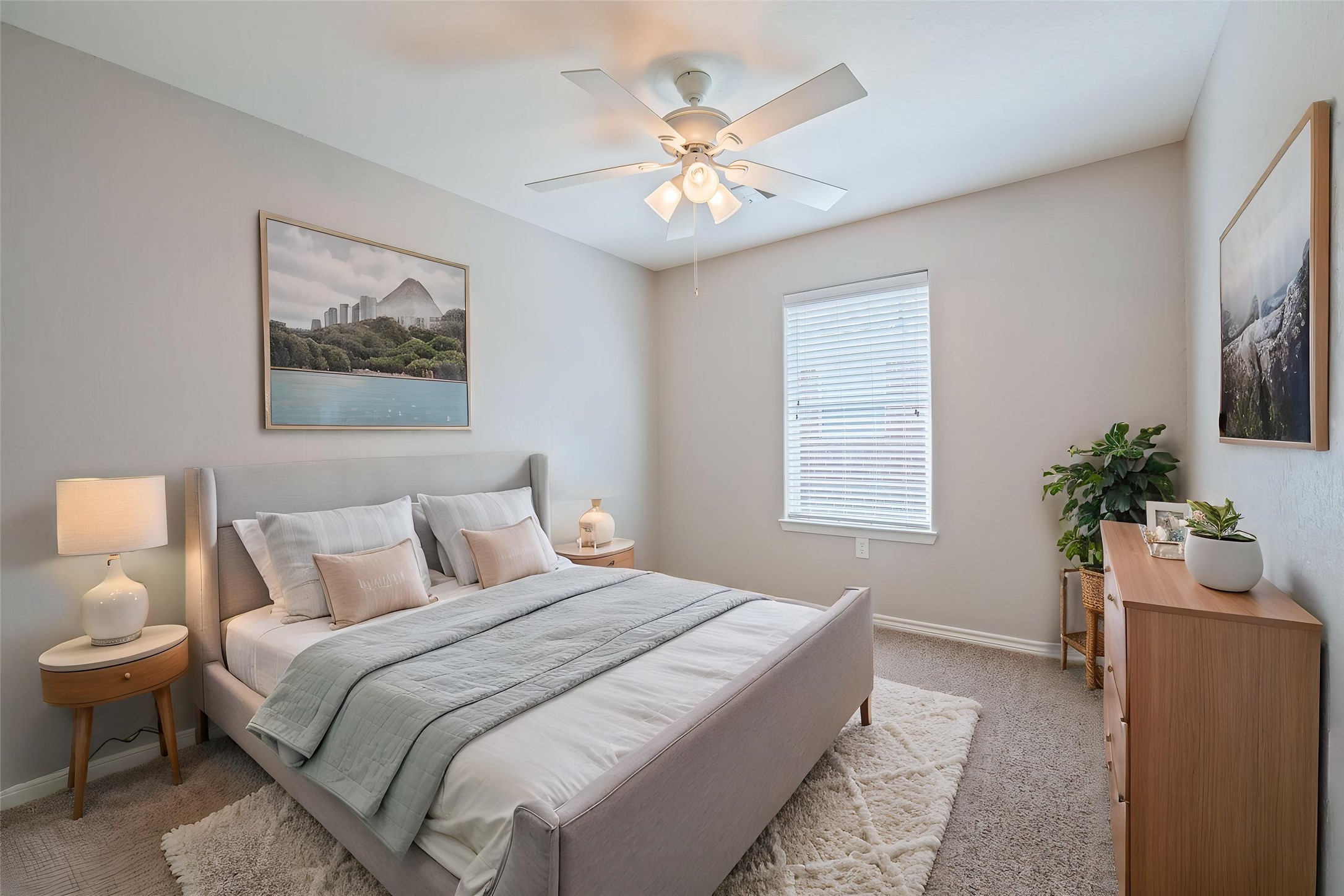 2nd bedroom with ceiling fan. Virtually staged.