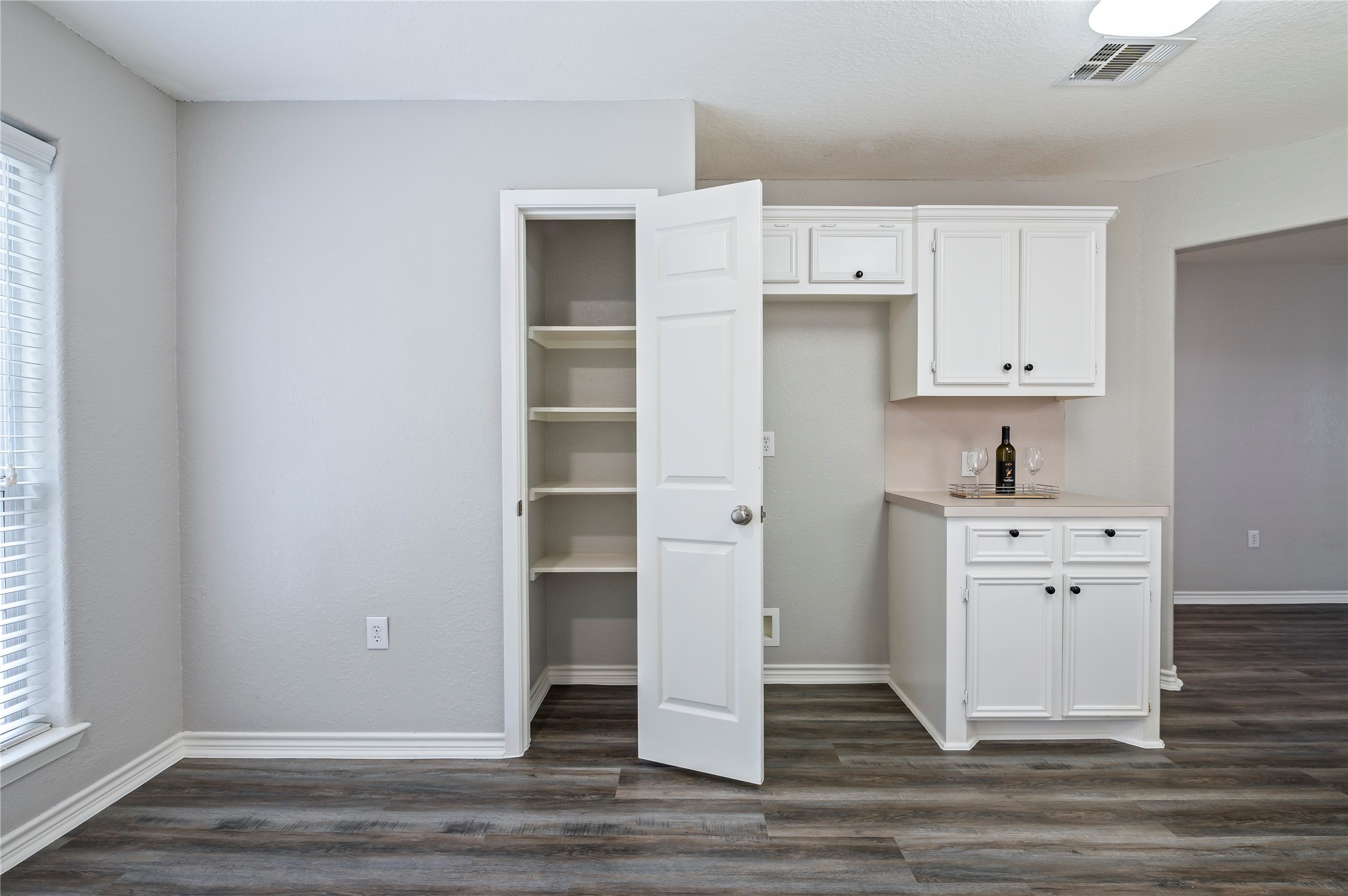 Pantry area in the kitchen with built in shelving.