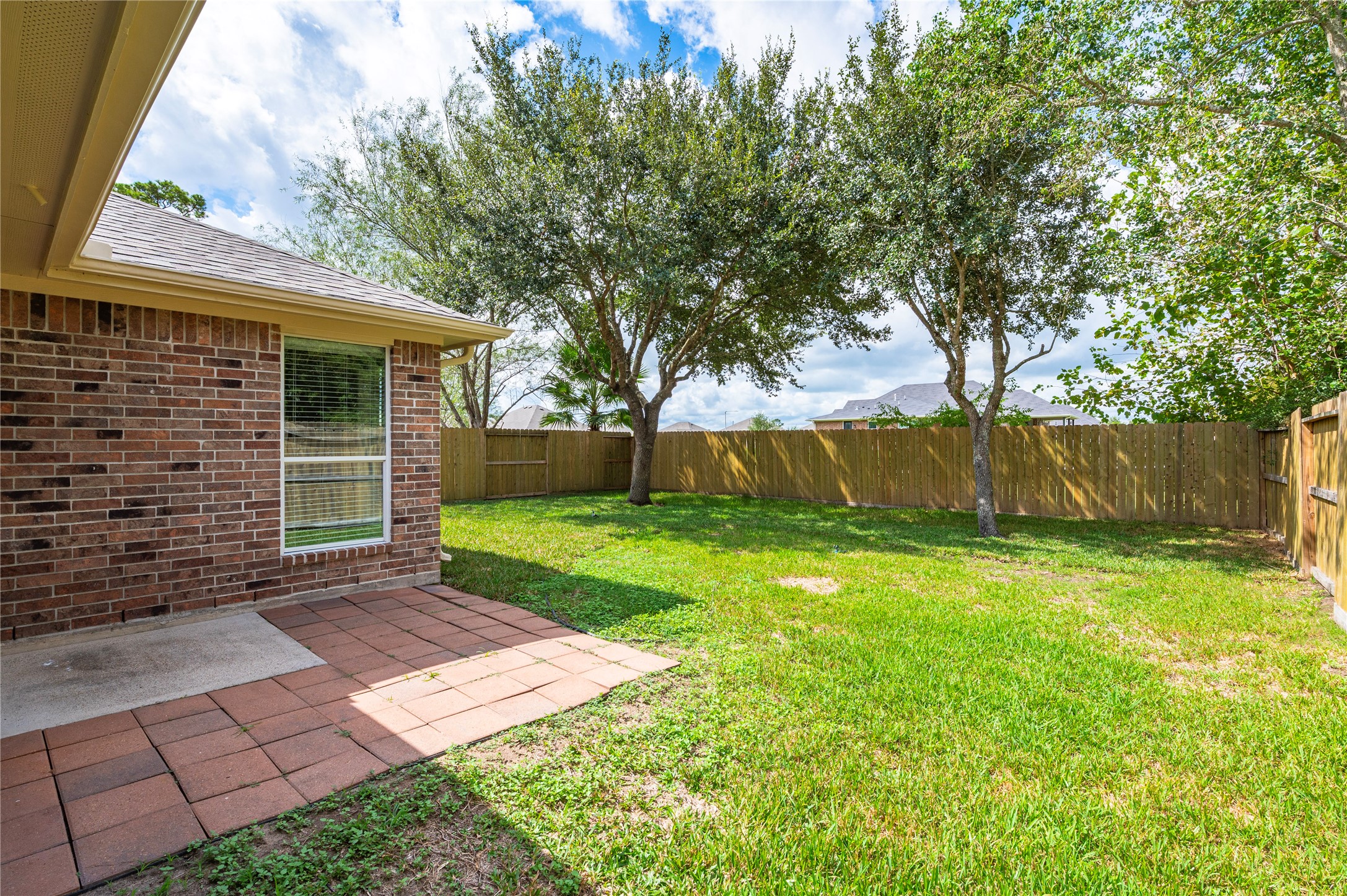 View of the back patio area and backyard.