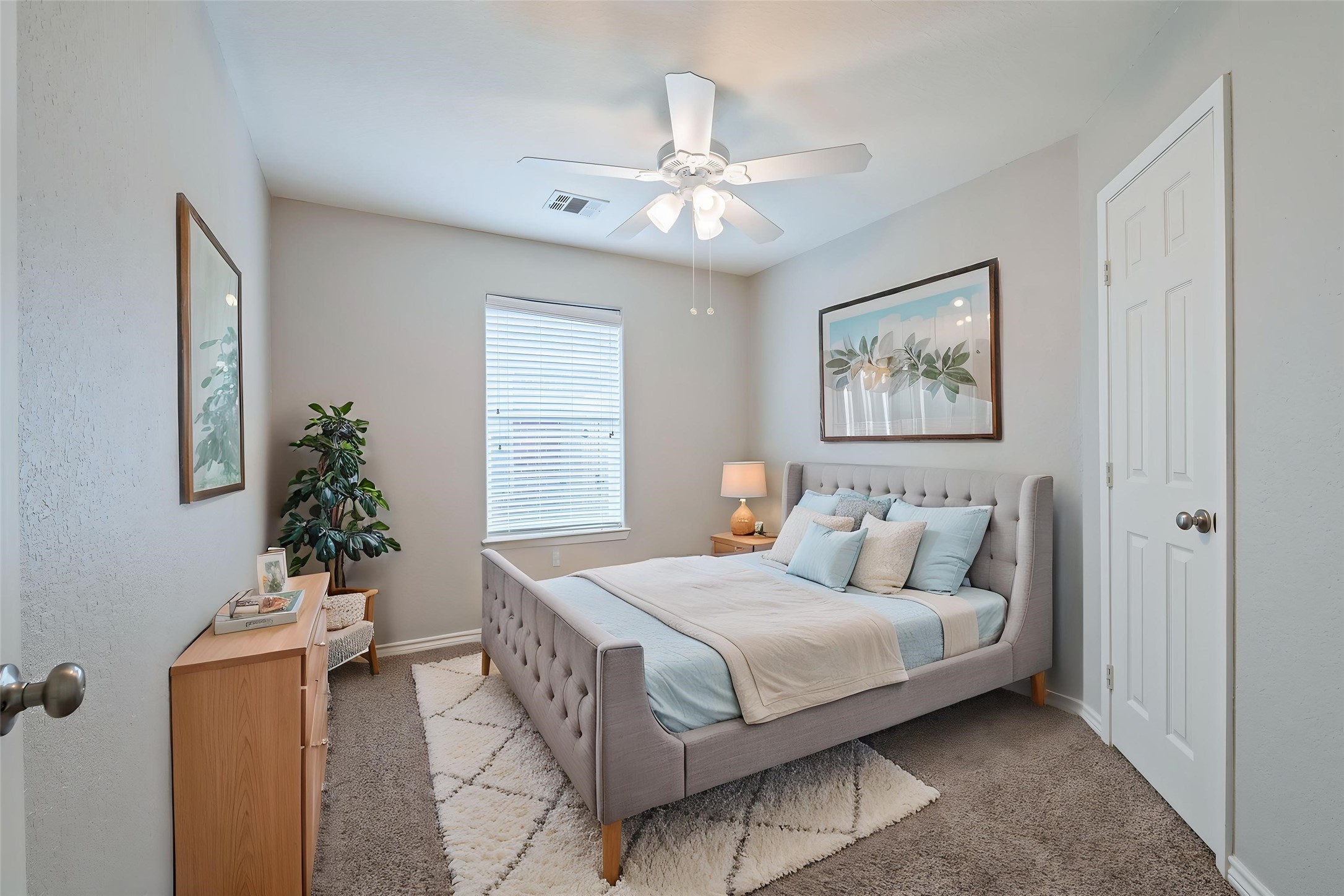 Virtually staged 3rd bedroom with ceiling fan.
