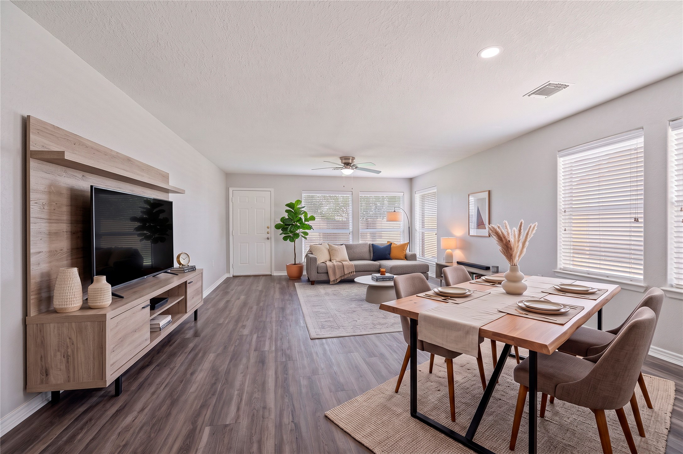 Virtually staged living room/dining space to image the possibilities.
