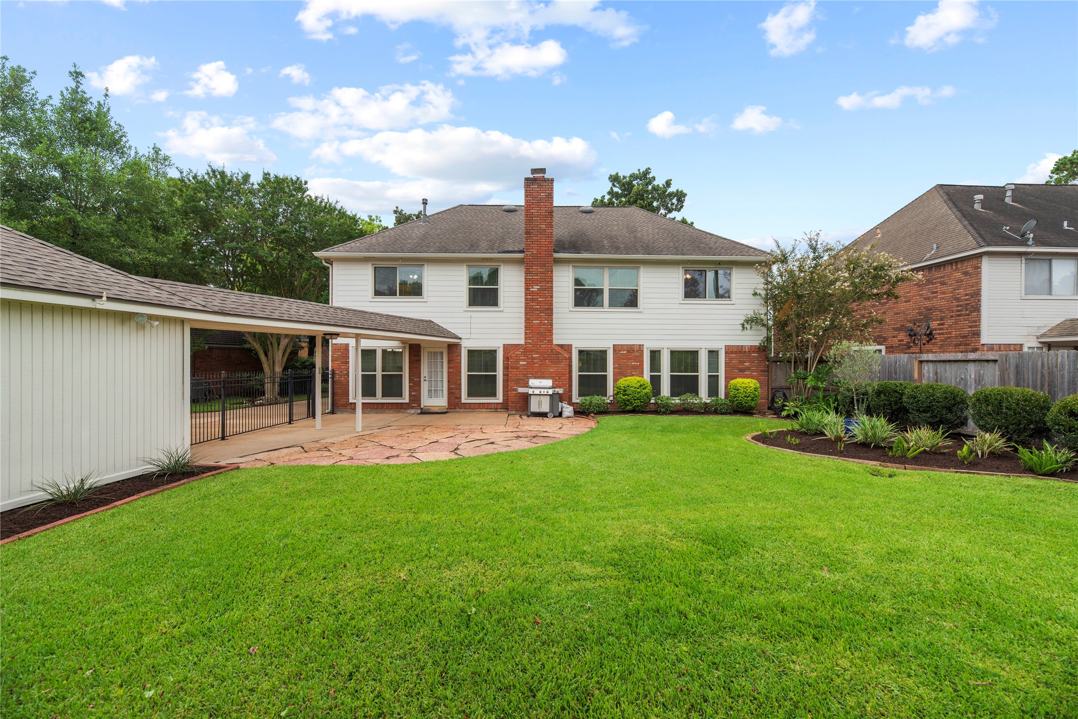 Step outside to a fully fenced backyard with mature landscaping, an expansive flagstone patio, privacy fence and a full sprinkler system in both the front and back to help keep everything looking its best.