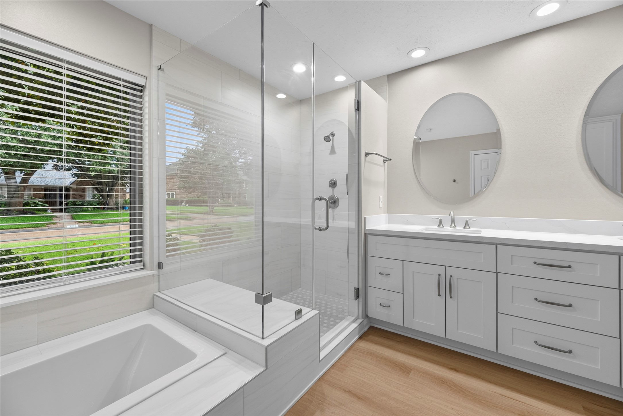 Slow down and enjoy a daily dose of luxury in the deep soaking tub or step into the oversized walk-in shower with frameless glass, dual controls and a body spray for a refreshing start or relaxing end to your day.