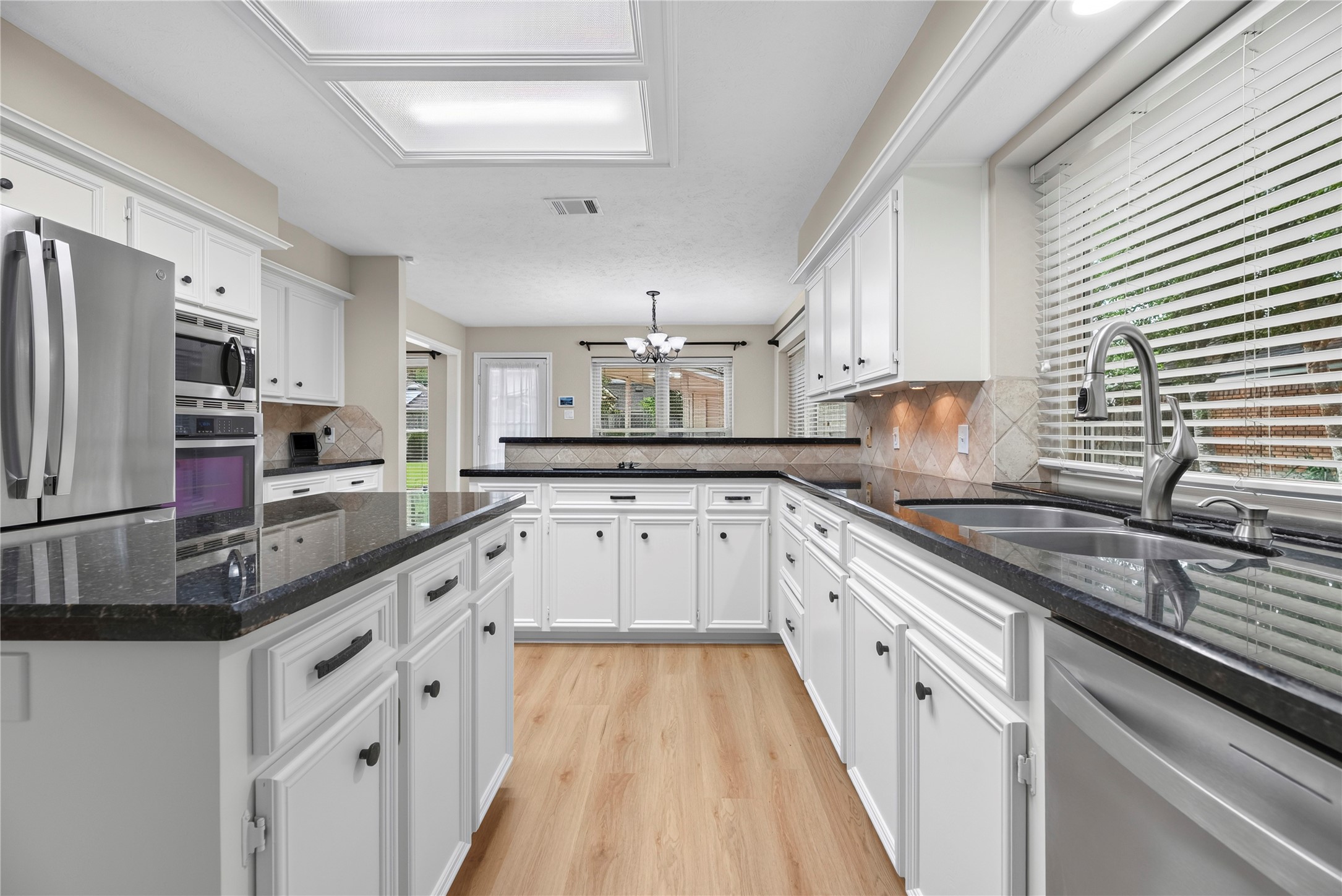 Ditch the takeout and enjoy home-cooked meals more often with the help of built-in stainless-steel appliances, plenty of counter space, abundant cabinet storage and a walk-in pantry that keeps everyday essentials close at hand.
