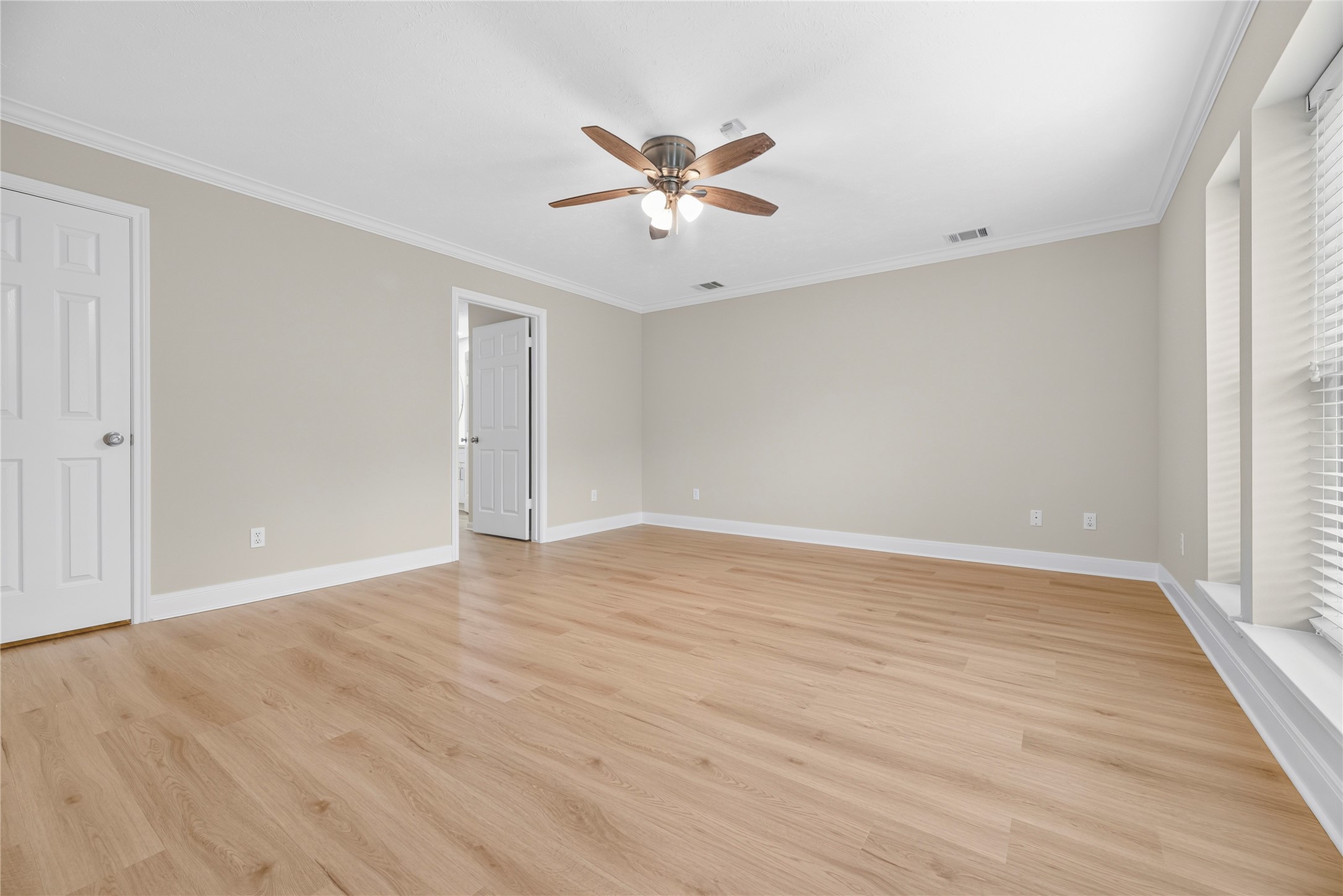 The owners suite offers a calm, comfortable place to begin and end each day, complete with updated LVP flooring, fresh neutral paint, updated windows and plenty of natural light. With 3 walk-in closets and a luxurious updated ensuite bathroom, storage and style are equally impressive.