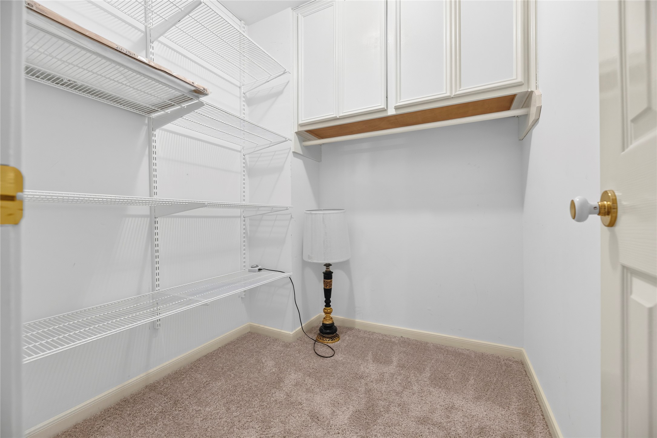 A very large walk-in closet sits just outside the flex room, offering extra storage for seasonal dcor and household items or serving as the dedicated closet when the flex space is used as a 5th bedroom.