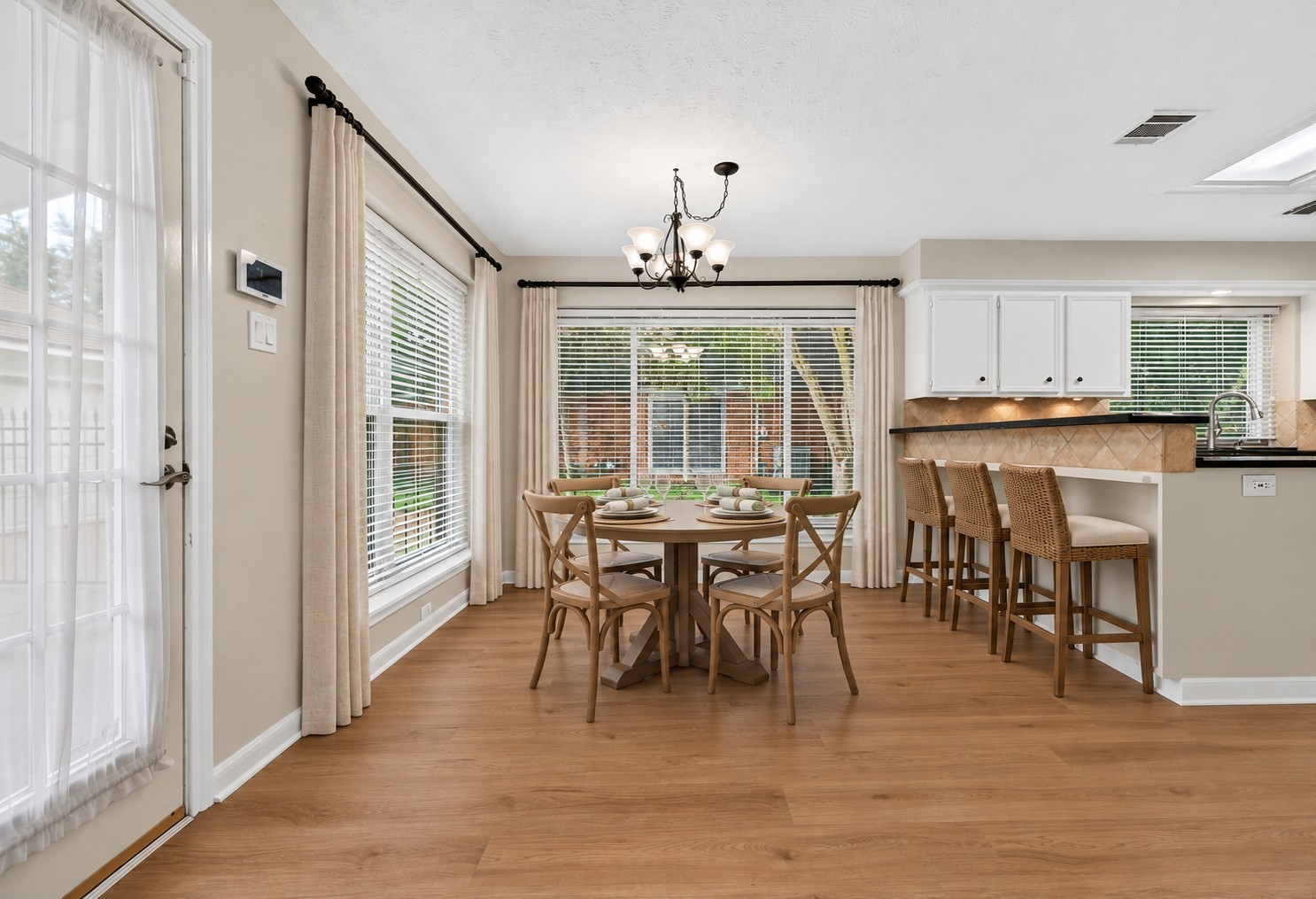 Virtually staged to inspire your imagination, this inviting breakfast area offers the perfect opportunity to create a cozy spot for morning coffee, casual meals and everyday moments with family and friends.