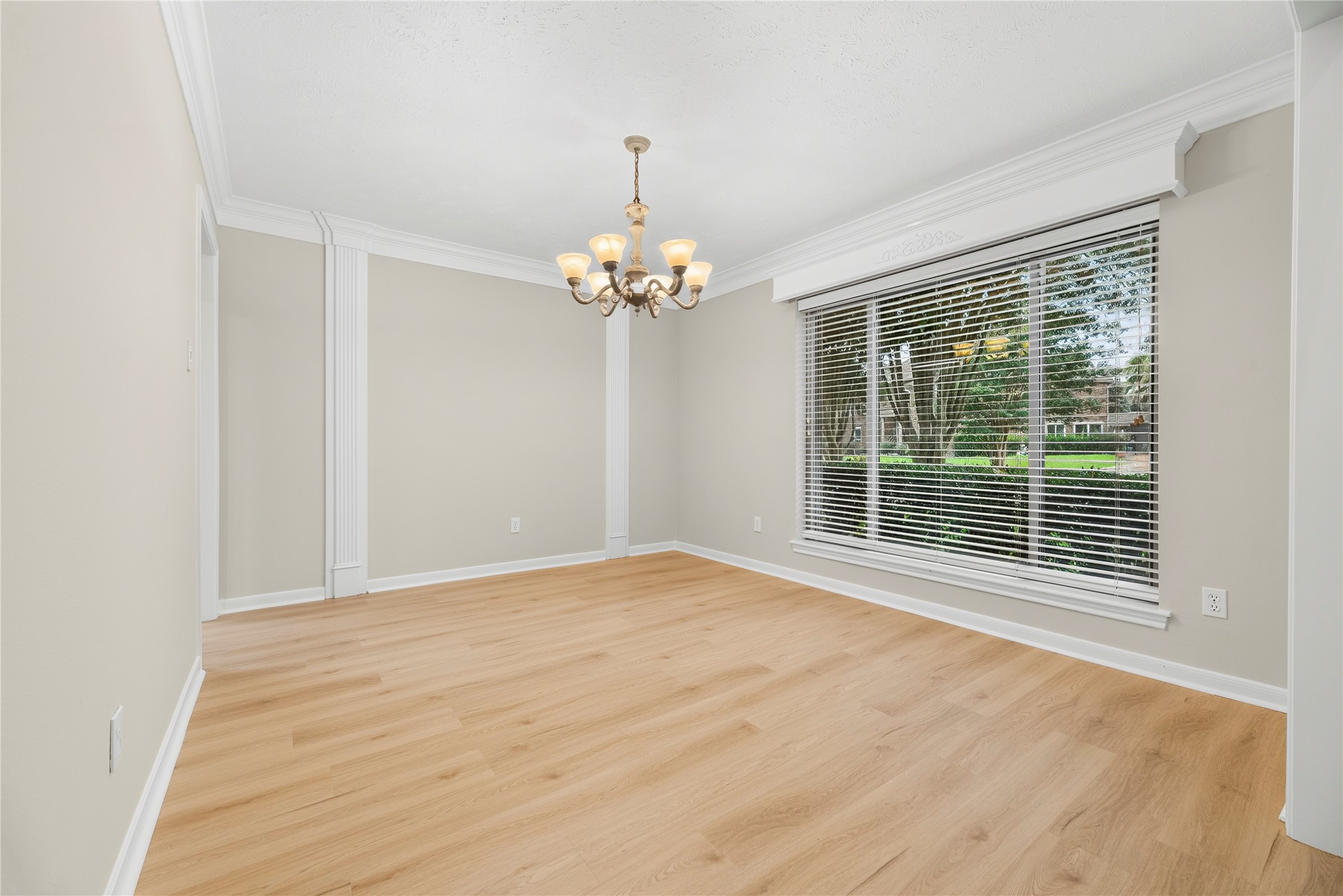 Your friends and family are going to love breaking bread with you in this elegant dining room. Wrapped in rich millwork and fresh neutral paint, the space also offers updated LVP flooring, stylish lighting and easy access to the kitchen, making hosting a breeze. Your friends and family are going to love breaking bread with you in this elegant dining room. Wrapped in rich millwork and fresh neutral paint, the space also offers updated LVP flooring, stylish lighting and easy access to the kitchen, making hosting a breeze.