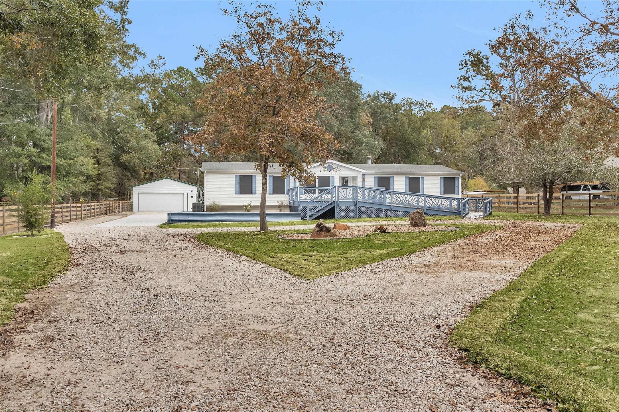 Welcome to 4621 Price Rd! Unrestricted land, a new garage and circle driveway with easy to maintain landscaping!