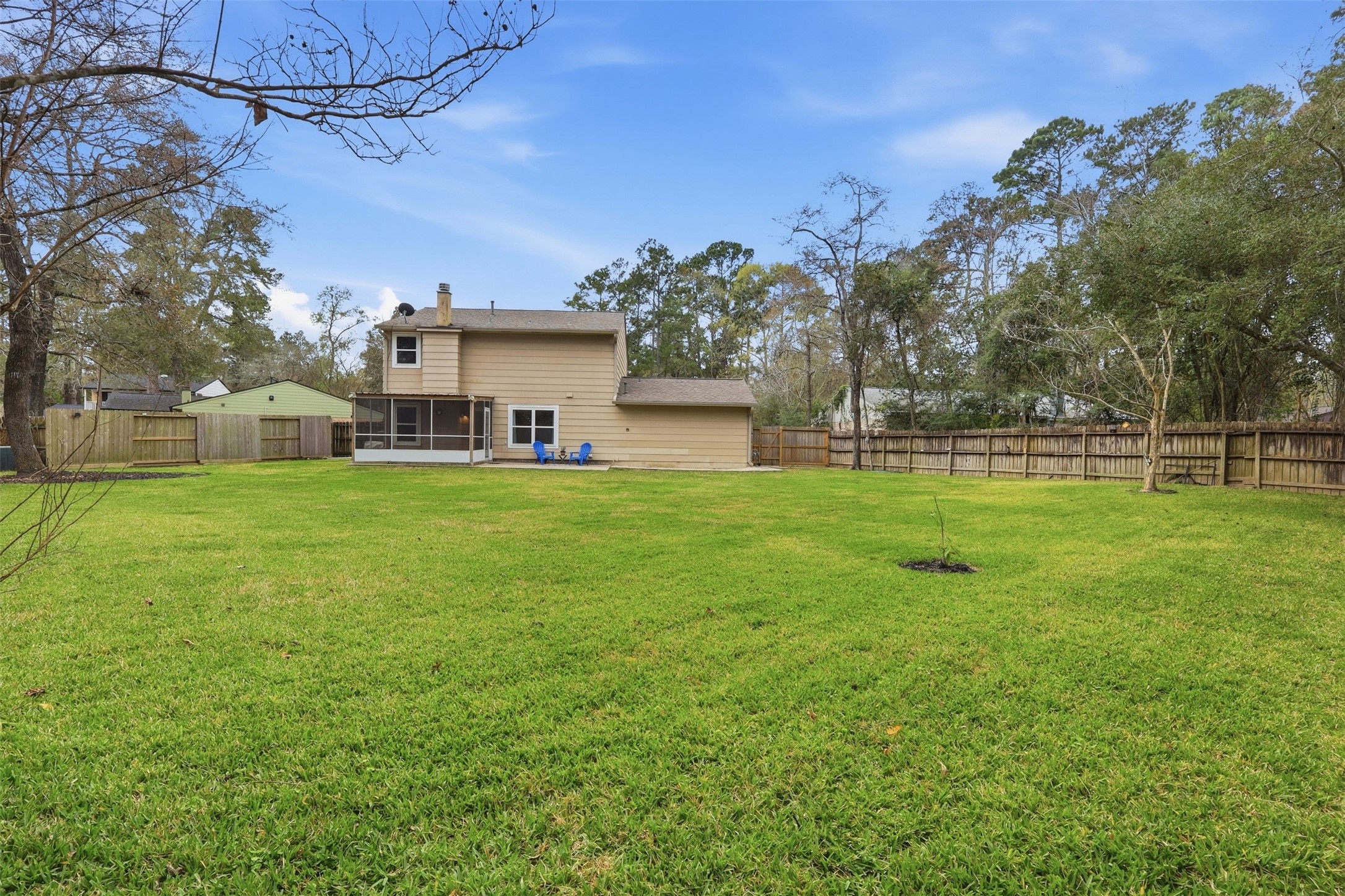 A spacious back yard with a sunroom and plenty of privacy is perfect for hosting, or enjoying the Texas sky with family. Perfect size for a pool!