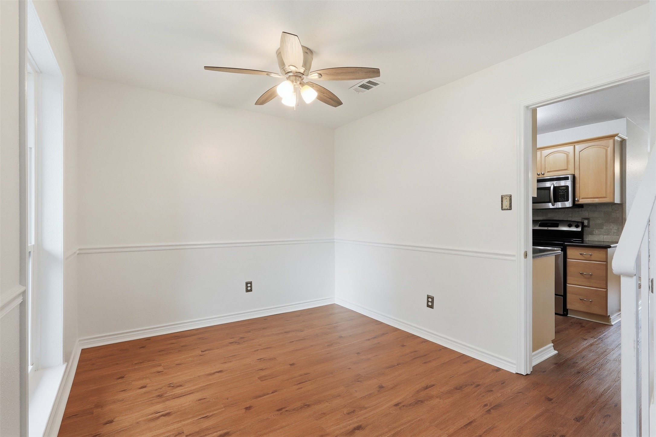 Spacious dining room with direct access to the kitchen. Perfect for family meal time or lavish dinner parties.