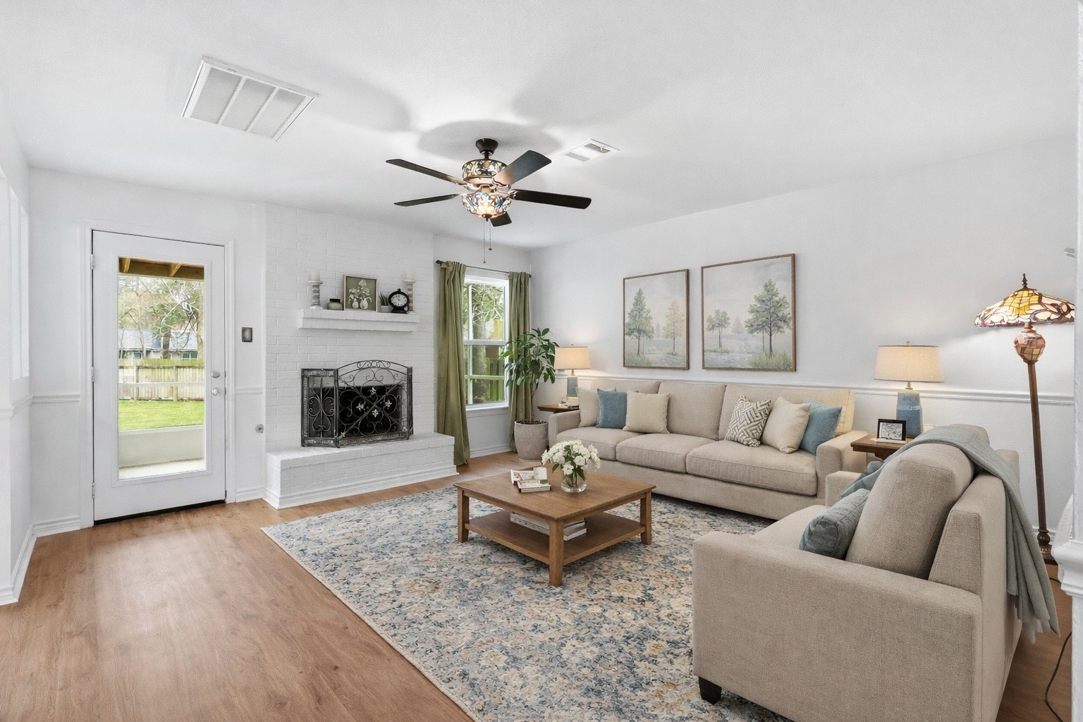 Virtually Staged. The beautiful stained glass ceiling fan, however, is a wonderful piece of this lovely Family Room.