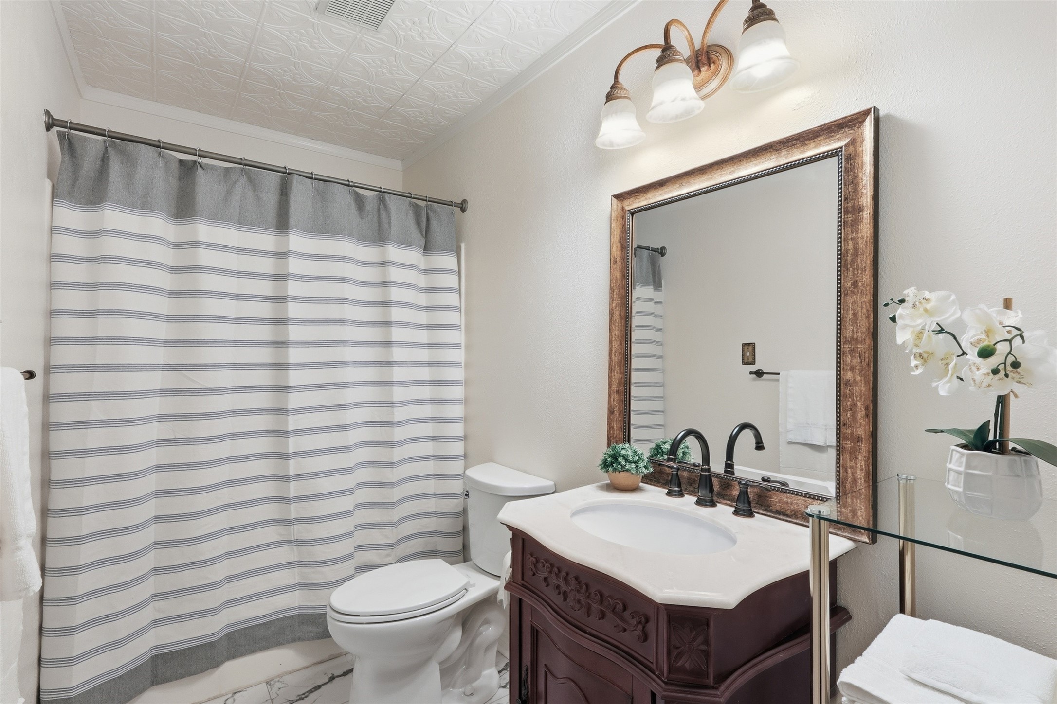 Primary bathroom with tub shower combo, perfect for soaking away any stresses!