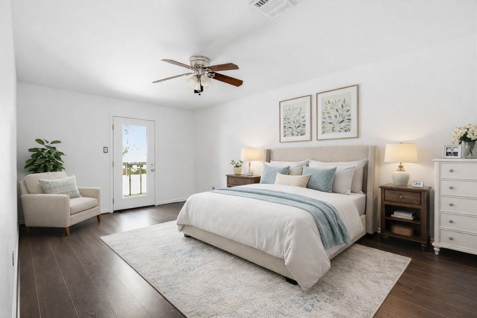 Virtually Staged. Primary bedroom with balcony access and upgraded energy efficient glass door.