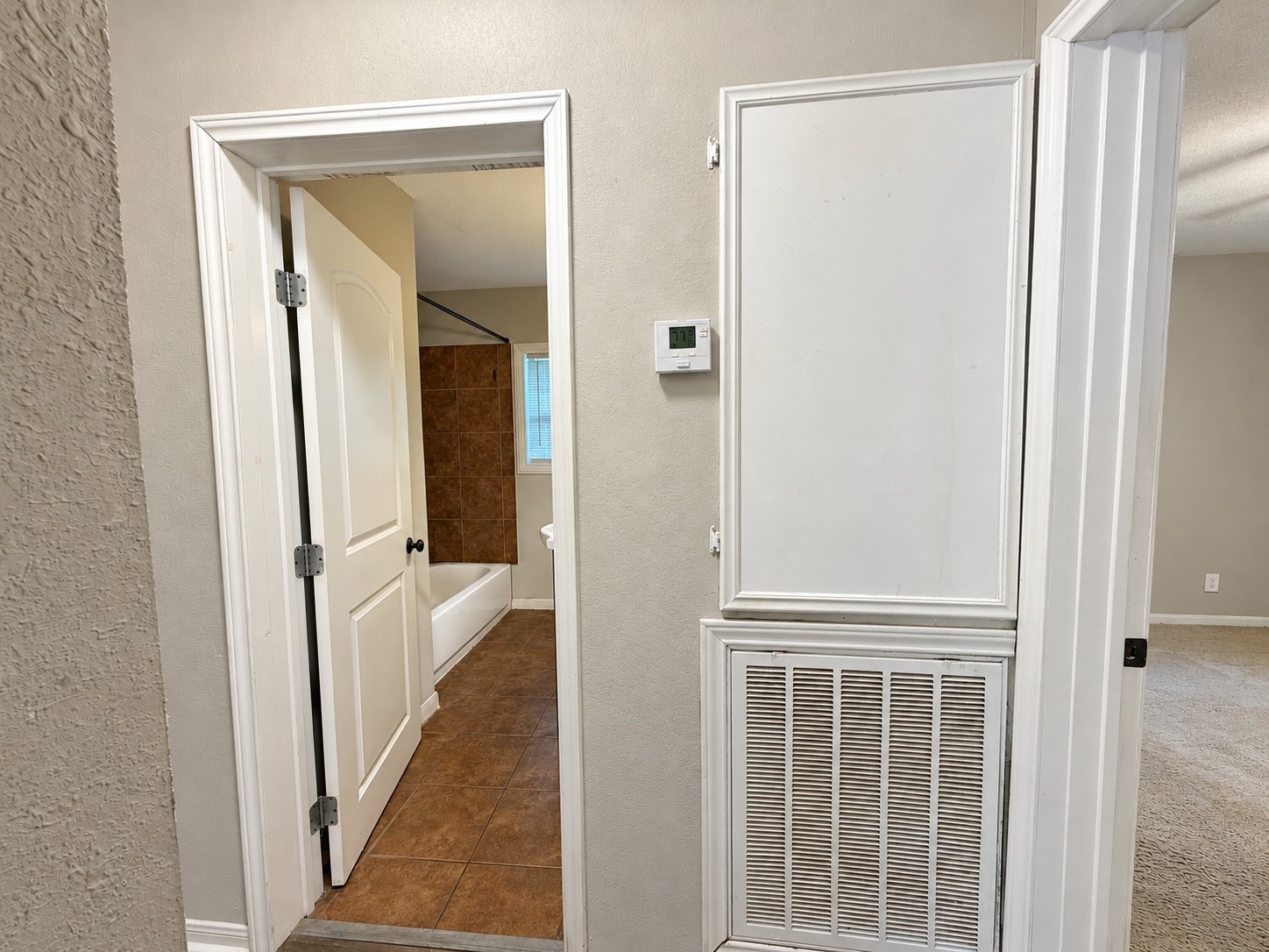Hallway connecting the bedrooms and bathroom.