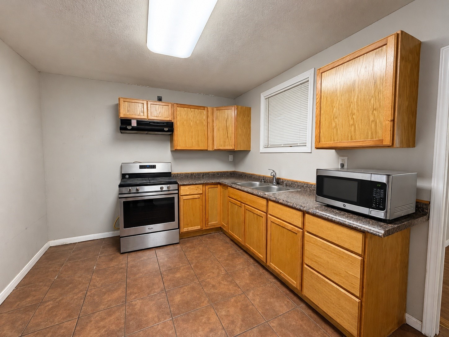 Another view of the 9.5x13 kitchen, with plenty of cabinet and counter storage.