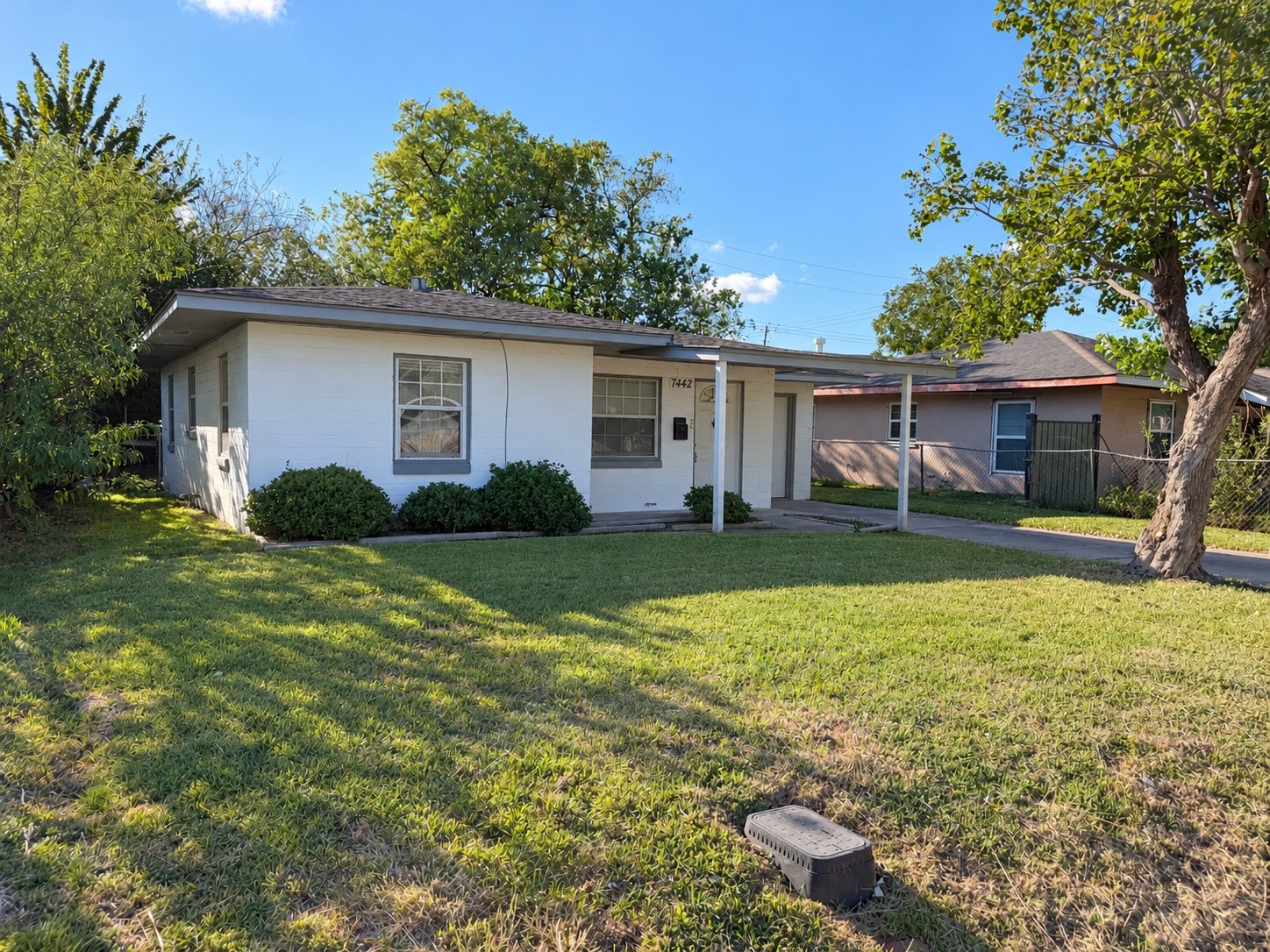 Front yard with plenty of green space and mature trees. Front yard with plenty of green space and mature trees.