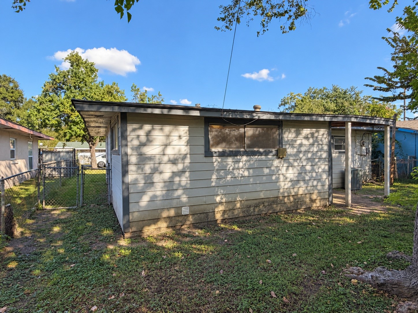 Rear yard view showing the back of the property.