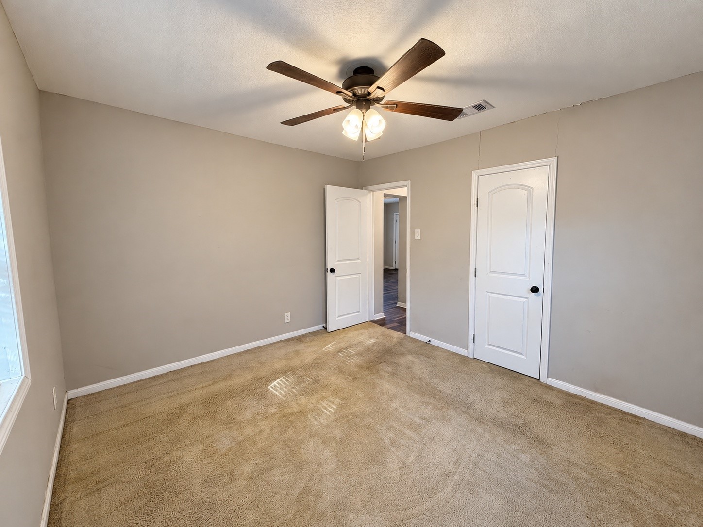 Another view of Bedroom 2, showing the closet and entry.
