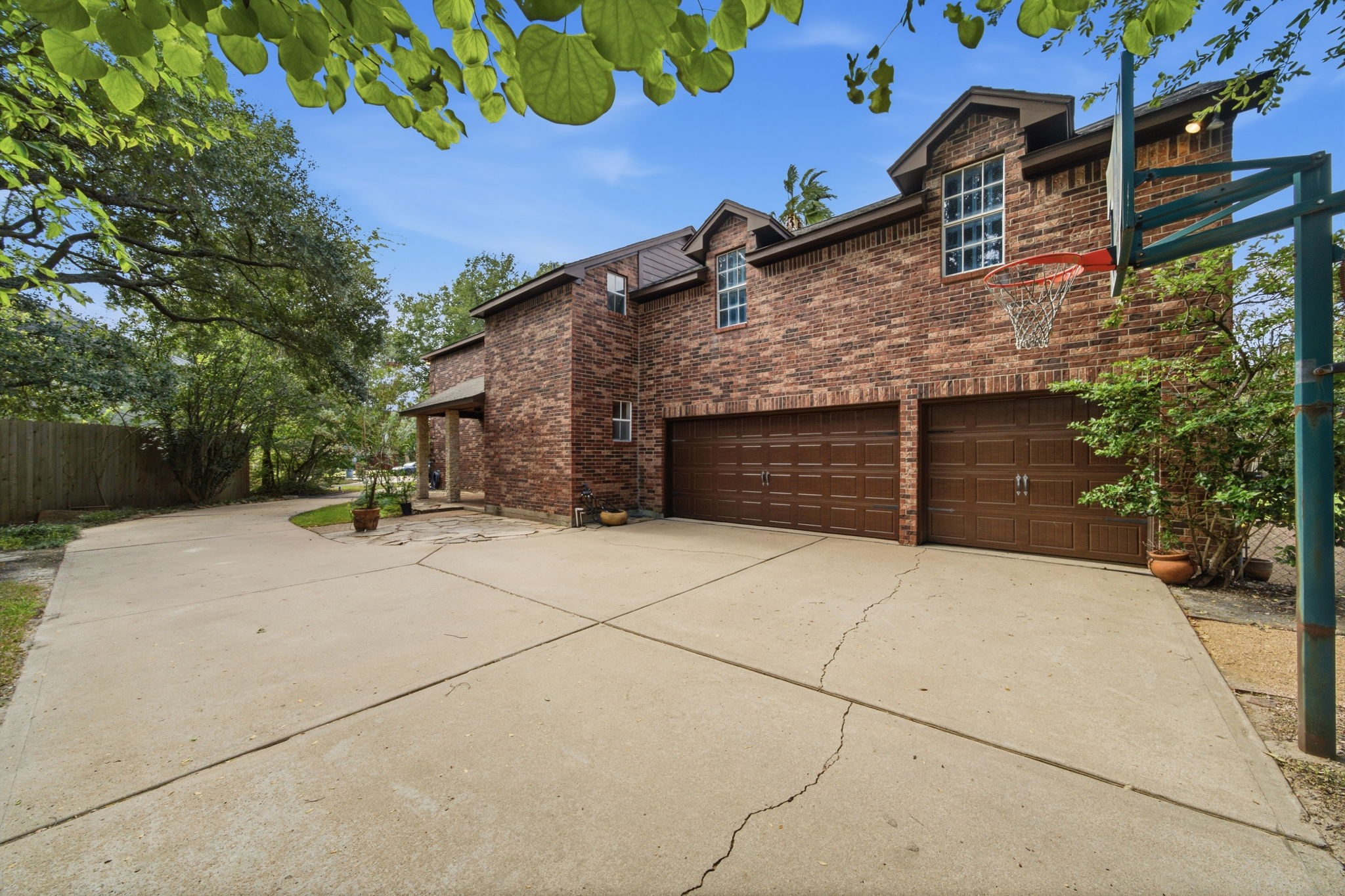 An impressive oversized three-car garage provides exceptional space for vehicles, storage, recreational gear, and more. Side yard and driveway presents so much space for cars and play. An impressive oversized three-car garage provides exceptional space for vehicles, storage, recreational gear, and more. Side yard and driveway presents so much space for cars and play.
