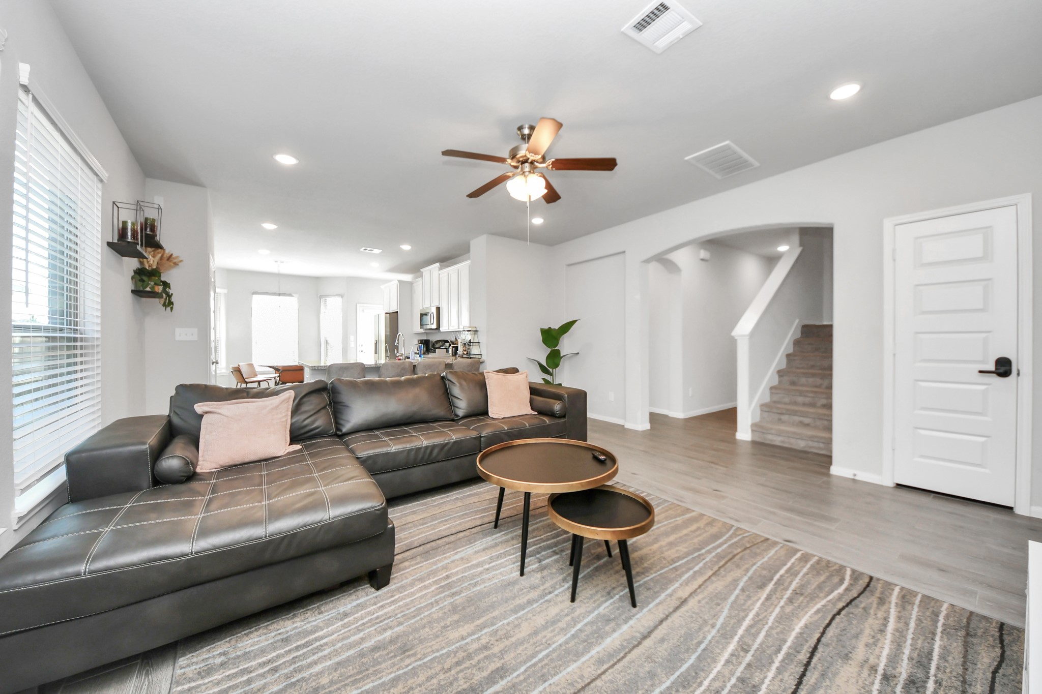 Living area leads to Primary bedroom and stairs