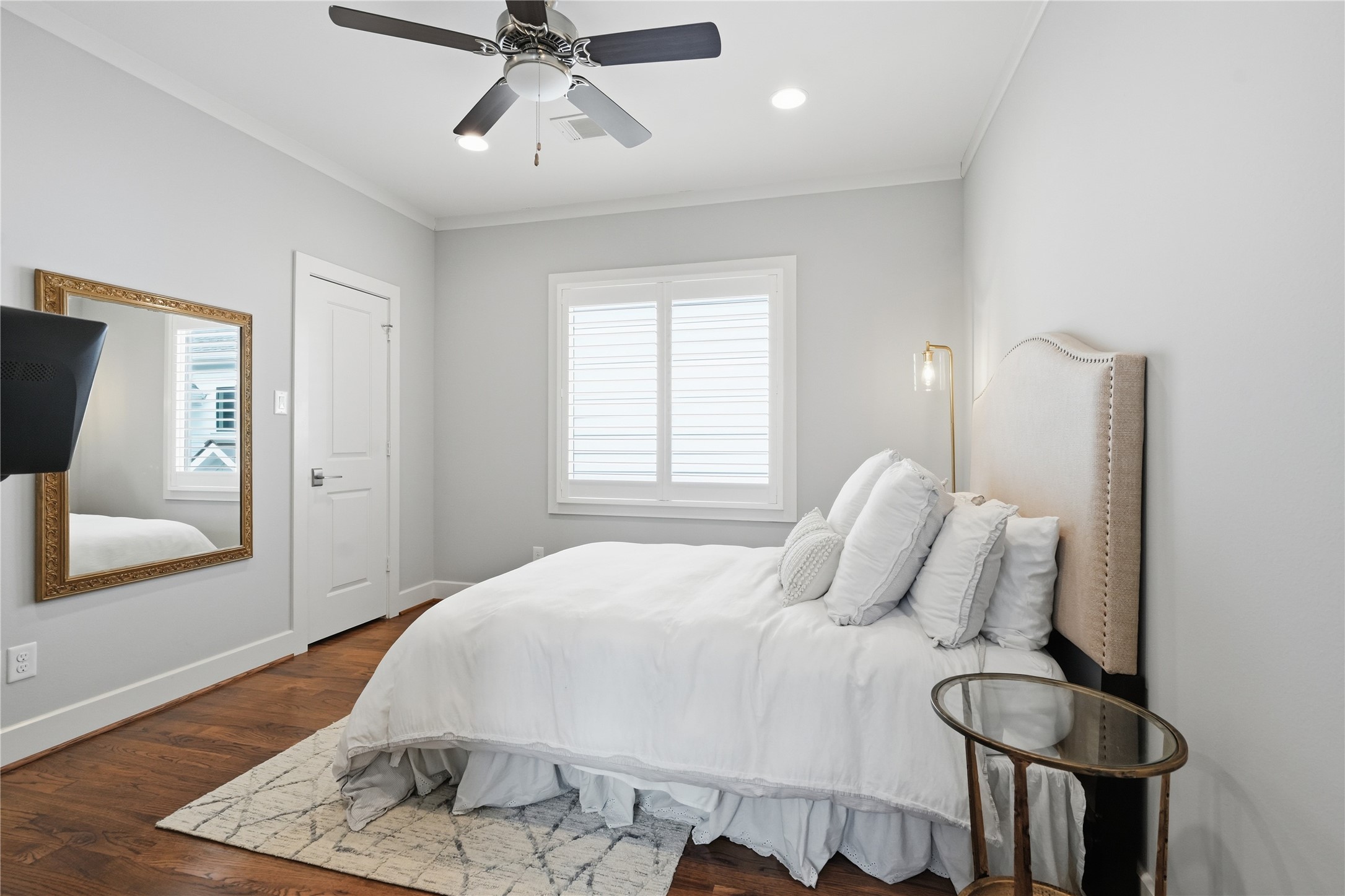 Comfortable second-floor secondary bedroom offers a walk-in closet and ample space for guests, family, or a home office.