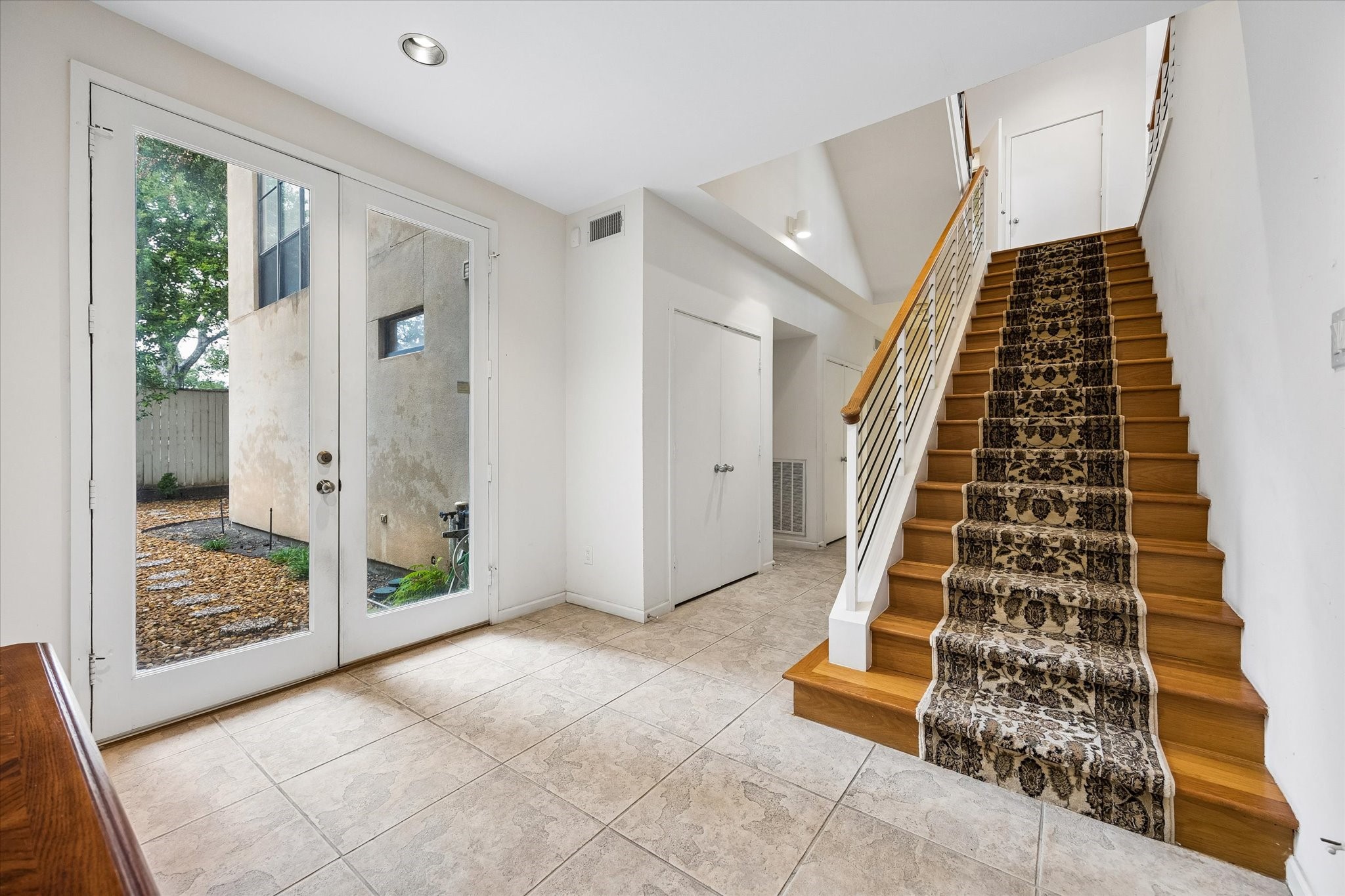 STEP INTO THE GRAND FOYER WHICH LEADS TO A MASSIVE OFFICE OR COULD BE 2 BEDROOMS, THAT HAS 2 FULL COMPLETE BATHS.  BEAUTIFUL FLOOR TO CEILIING DOORS AND WINDOWS THROUGHOUT THIS LOVELY HOME.
