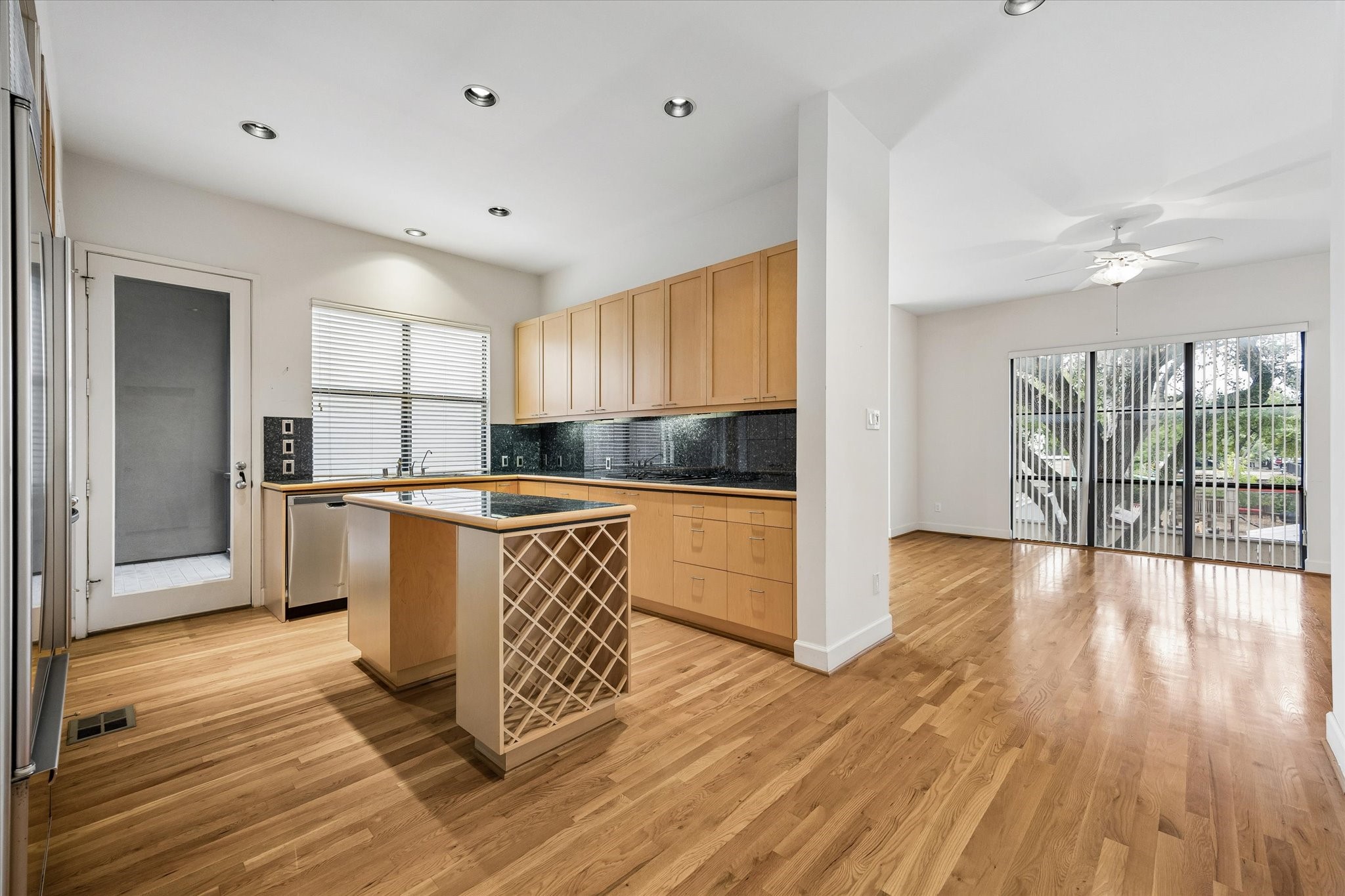 VIEW INTO DINING ROOM FROM THE KITCHEN AREA.  THESE FLOORS ARE IMMACULATE THROUGHOUT.  THIS HOME HAS BEEN SOFTLY LIVED IN, BUT SO ENJOYED.