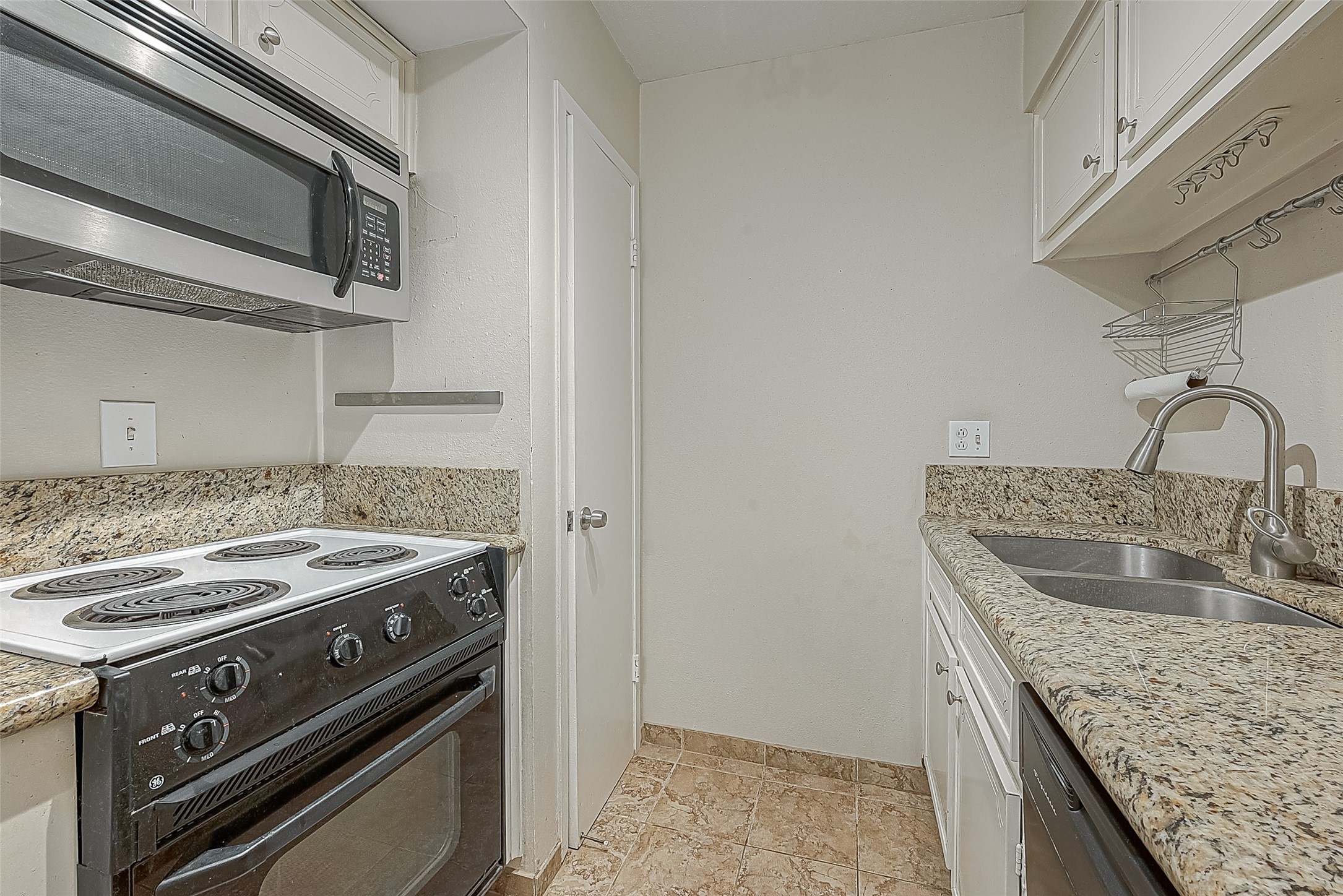 Storage is always a plus! At the far end of the kitchen is a sizeable pantry with plenty of room for groceries, small appliances & everyday essentials. Another great storage feature in this 1-bedroom condo!