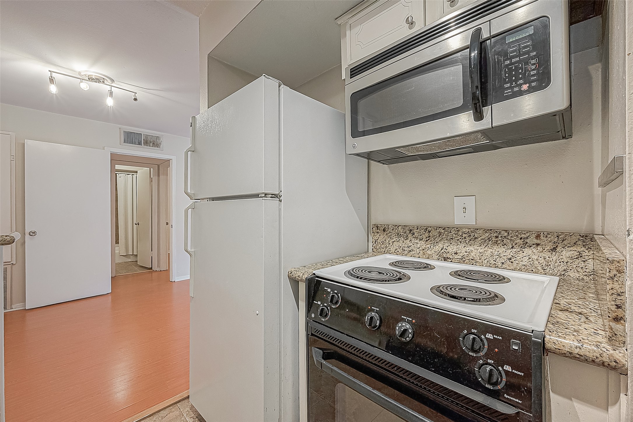 The kitchen comes equipped with the appliances you needincluding a refrigerator, electric range & built-in microwave. Best of all, the refrigerator stays with the condo, so thats one less thing to worry about when moving in!