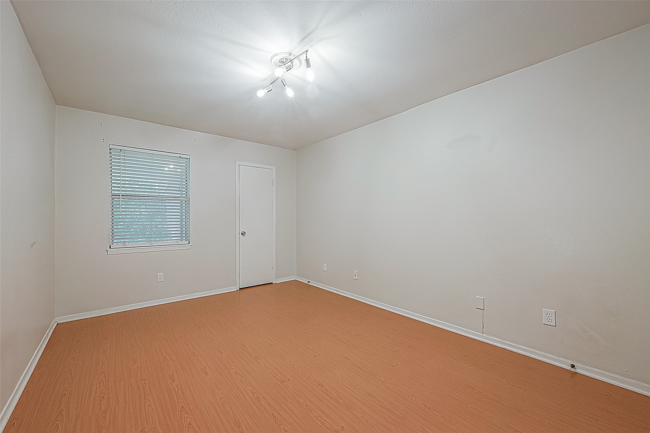 Natural light comes through the bedroom window with a view of the courtyard below. At the far end of the room is a lighted, walk-in closet offering plenty of space for clothing, shoes & more. Remember all that extra storage we mentioned? This condo has it!