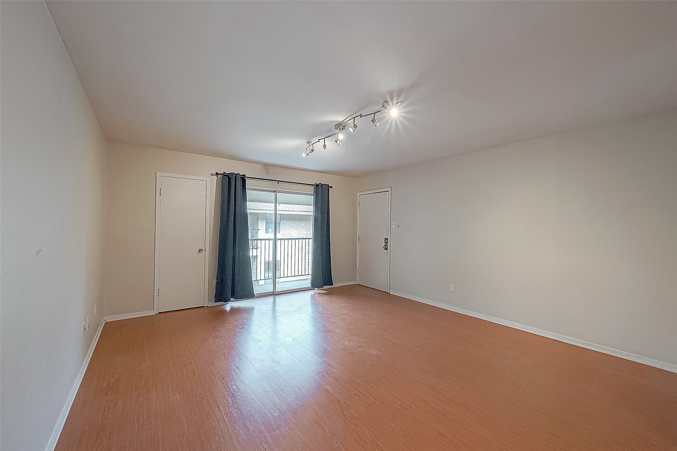 Natural light fills the spacious living room through the sliding glass door leading to the 2nd-floor balcony overlooking the courtyard. Simply step outside and enjoy a little fresh air or unwind at the end of the day. Natural light fills the spacious living room through the sliding glass door leading to the 2nd-floor balcony overlooking the courtyard. Simply step outside and enjoy a little fresh air or unwind at the end of the day.